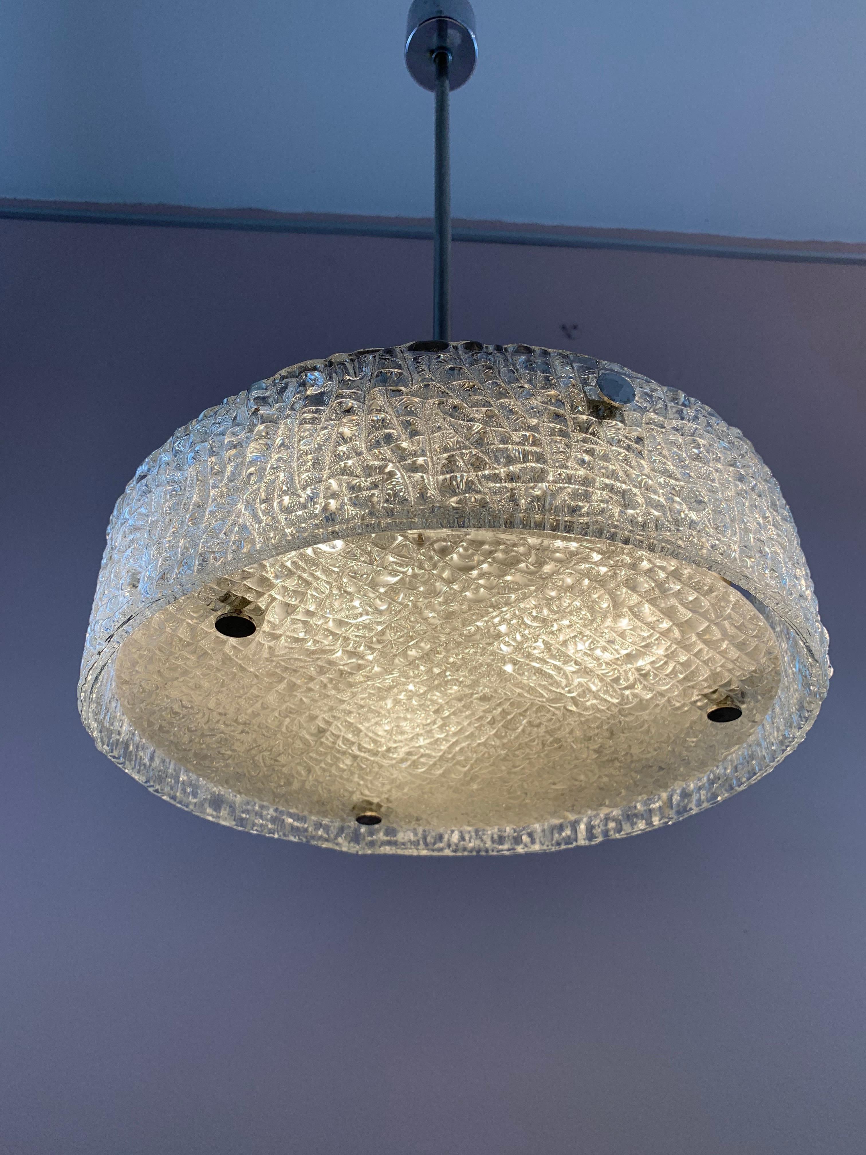 A midcentury, textured, ice-glass, hanging, ceiling, pendant light, which was manufactured in Germany, by Kaiser Leuchten in circa 1960s. The rod can be unscrewed and removed if you require a flush mounted ceiling light instead. The thick textured