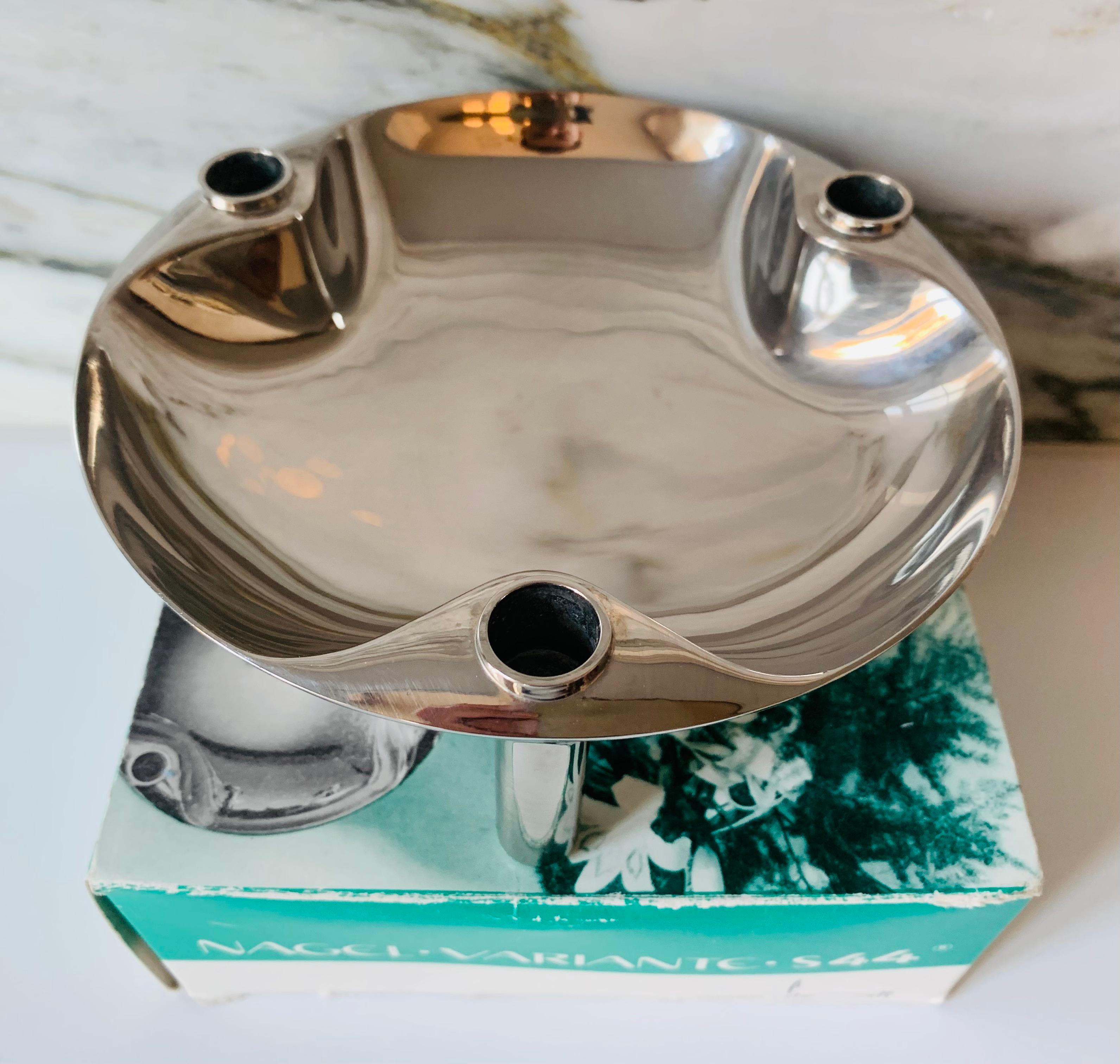 An original 1960s West German modular candleholder tray or dish, including the original box, manufactured by BMF Nagel. The tray can also be used as a base to support the BMF Nagel triangular candleholders, which are sold separately and illustrated