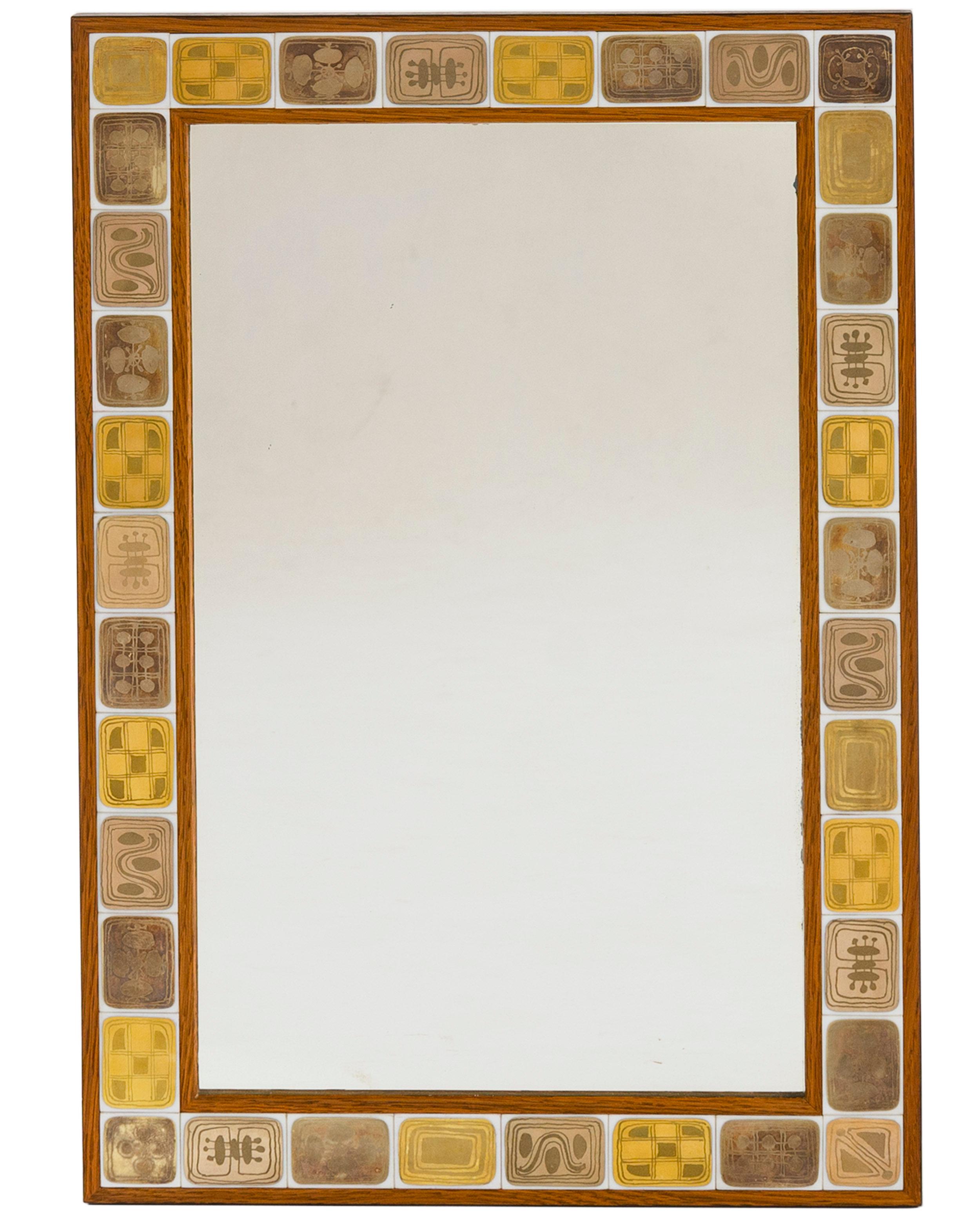 A finely crafted wall mirror having a border of thirty six small (1.5 x 1.25 inches) porcelain tiles. There are twelve individual designs each having gold decorations on white bodies repeated to form the border. The tiles are set in a mitered oak