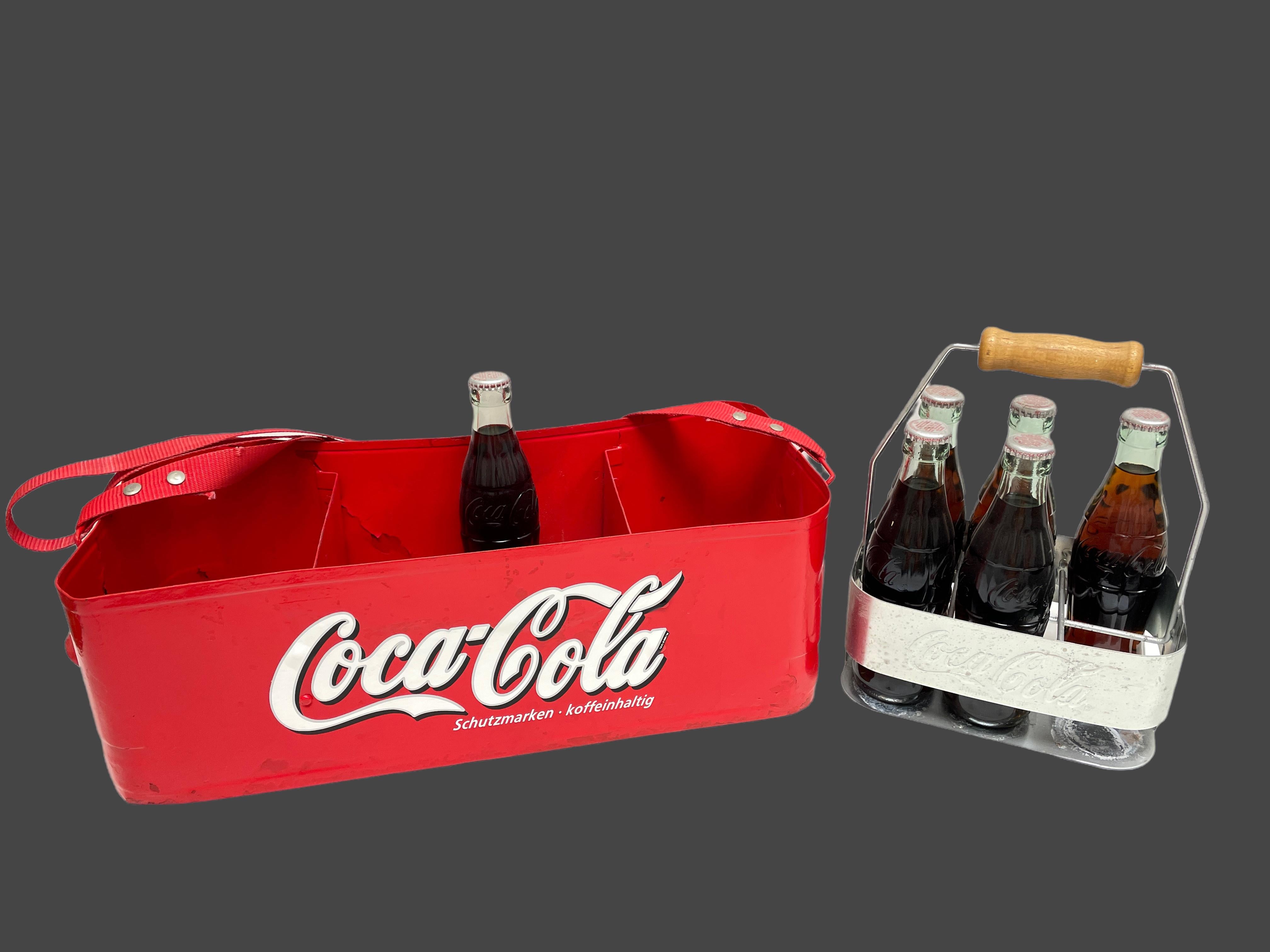 This vintage metal Coca-Cola vending tray, in red and white, was used in the 1960s in Germany to sell Coca-Cola's sodas during sport events at stadiums. It is approx. 6.13