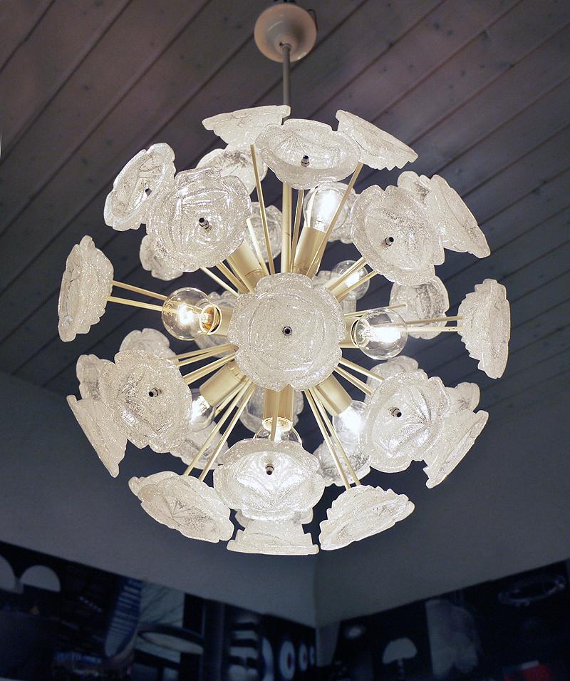 Elegant mid century modern Sputnik Chandelier with white Murano glass on an enameled frame. Glass elements resemble frozen glass roses fixed on a creamy white brass frame. Chandelier illuminates beautifully and offers a lot of light. Gem from the