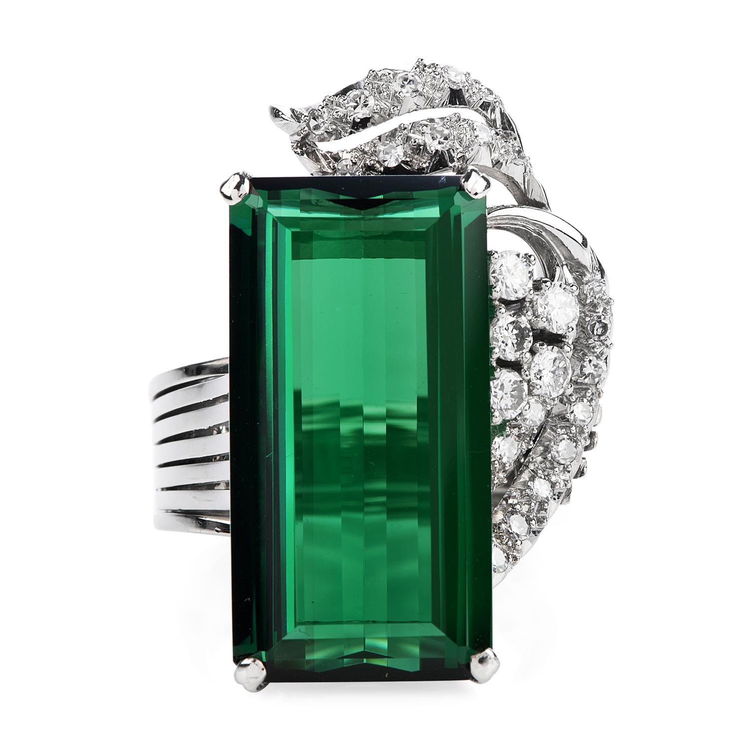 Vintage style GIA certified Green Tourmaline & Diamond cocktail ring, with dazzling floral & ribbon side design.

Crafted in solid platinum, the center is adorned by a GIA certified Green Tourmaline, octagonal step cut, prong set, weighing