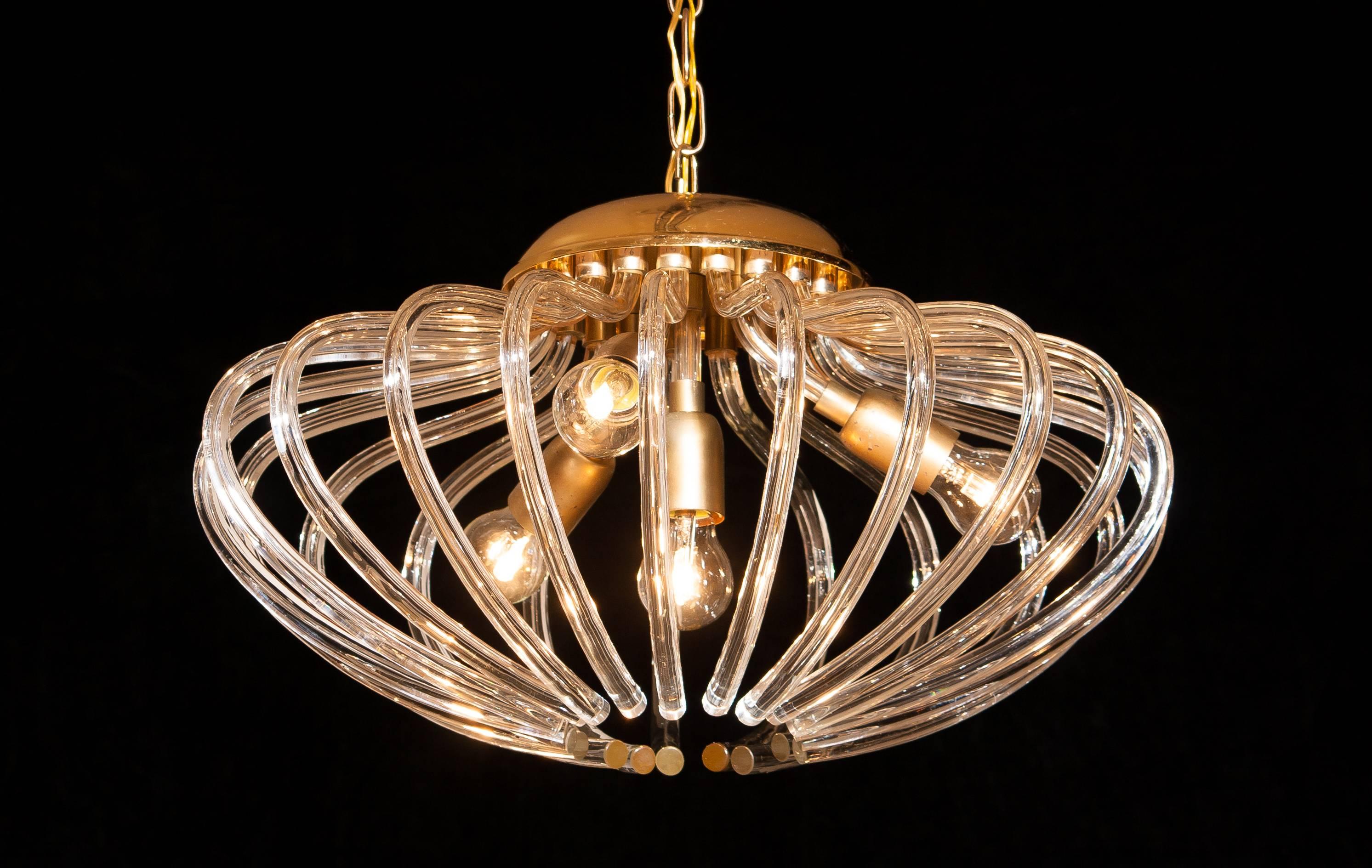 Amazing chandelier by Murano, Italy.
This lamp has a beautiful pumpkin shape and is partly gilded with clear crystal elements.
It is in an excellent condition.
Period 1960s
Dimension Total height 80cm, ø.55 cm.