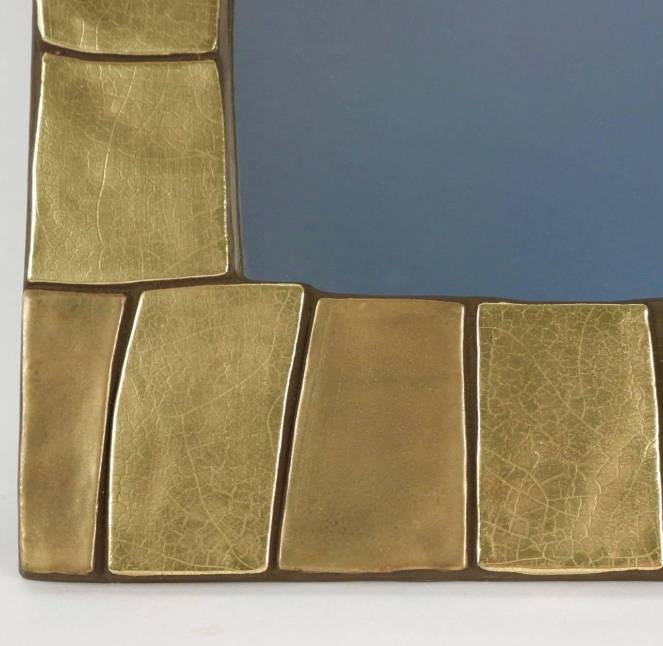 1960s gilded and enameled ceramic mirror, by Mithé Espelt 

The frame is composed by gilded and enameled ceramic tiles of different shades and textures.