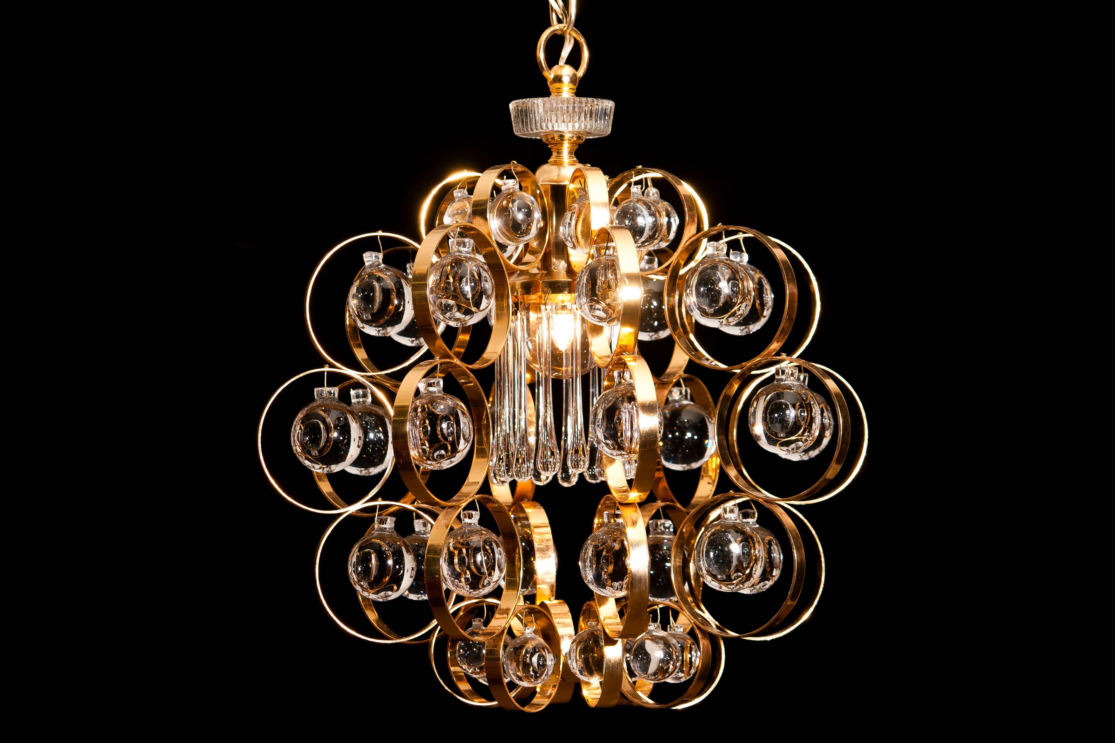 Beautiful chandelier by Palwa Germany.
This amazing lamp is made of gilded brass with Murano glass elements.
It is in a wonderful condition. 
Period 1960s
Dimensions H 58 cm, ø 40 cm.