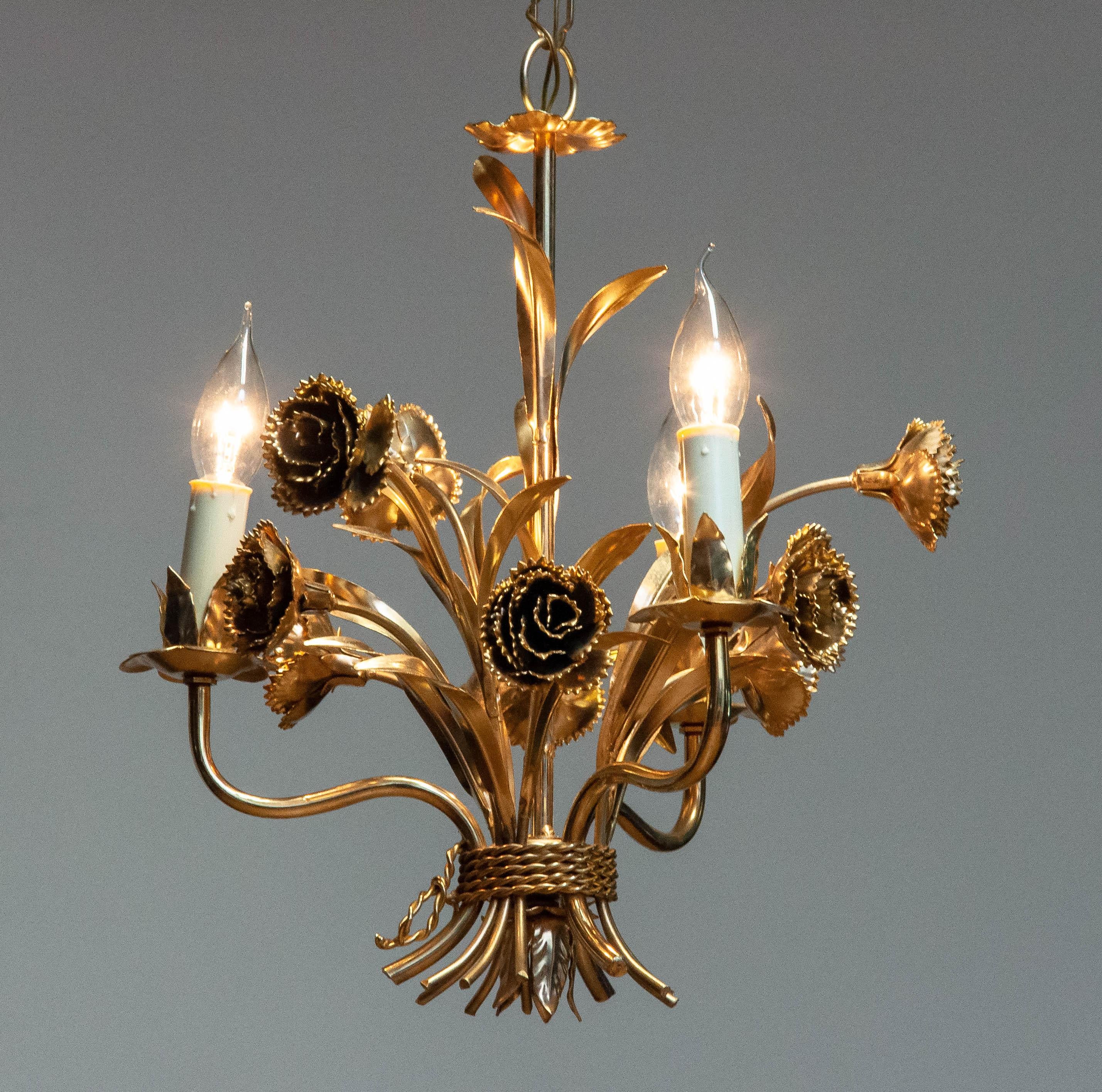 Hans Kögl gilded floral chandelier, Germany, 1970s. This elegant chandelier features a detailed gilt metal frame adorned with sculpted flowers and leaves, embodying Kögl's signature botanical design. Fitted with E14 screw sockets, this decorative