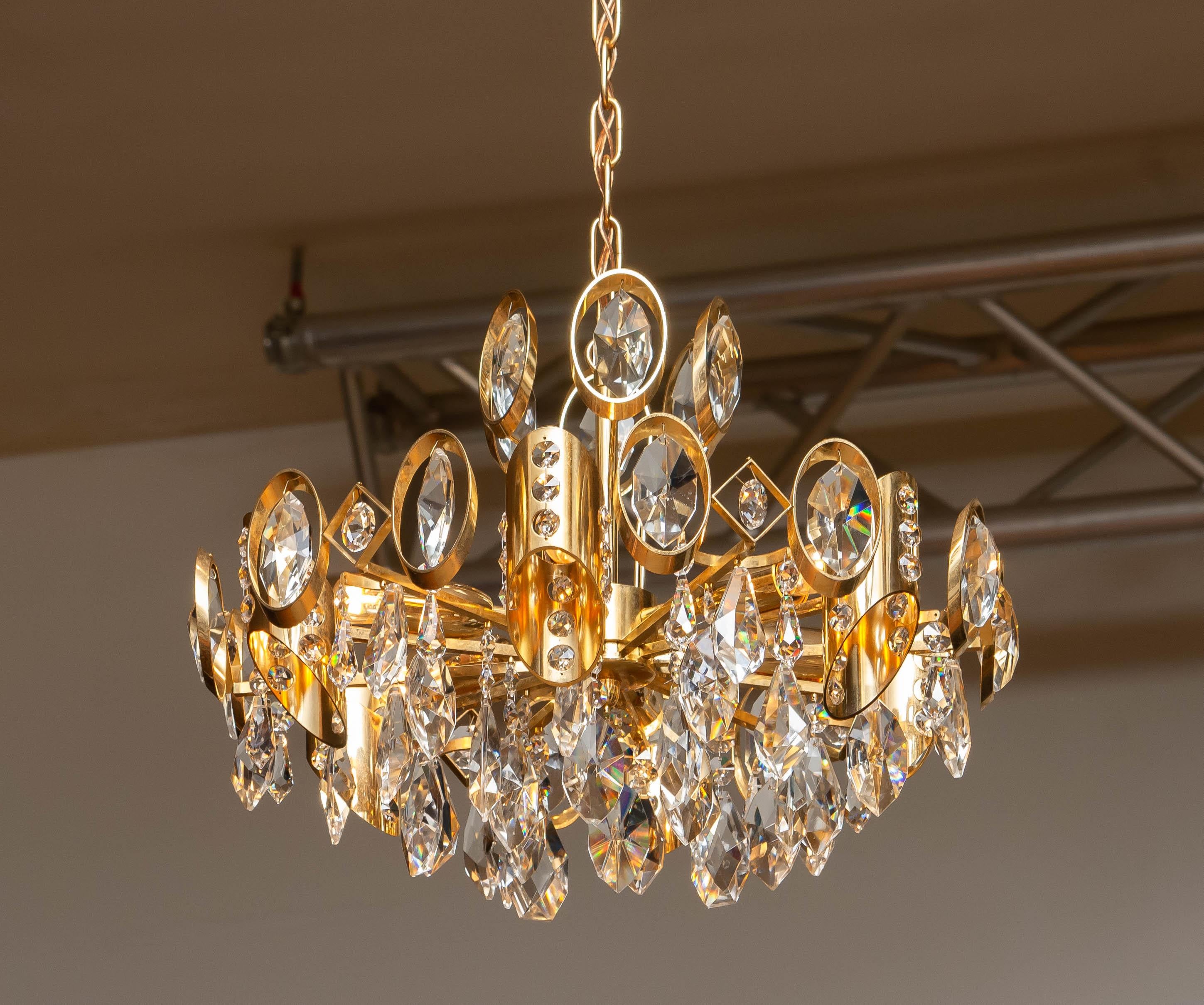Austrian 1960's Gilt Brass Filled with Large Faceted Crystals Chandelier by Ernest Palme For Sale