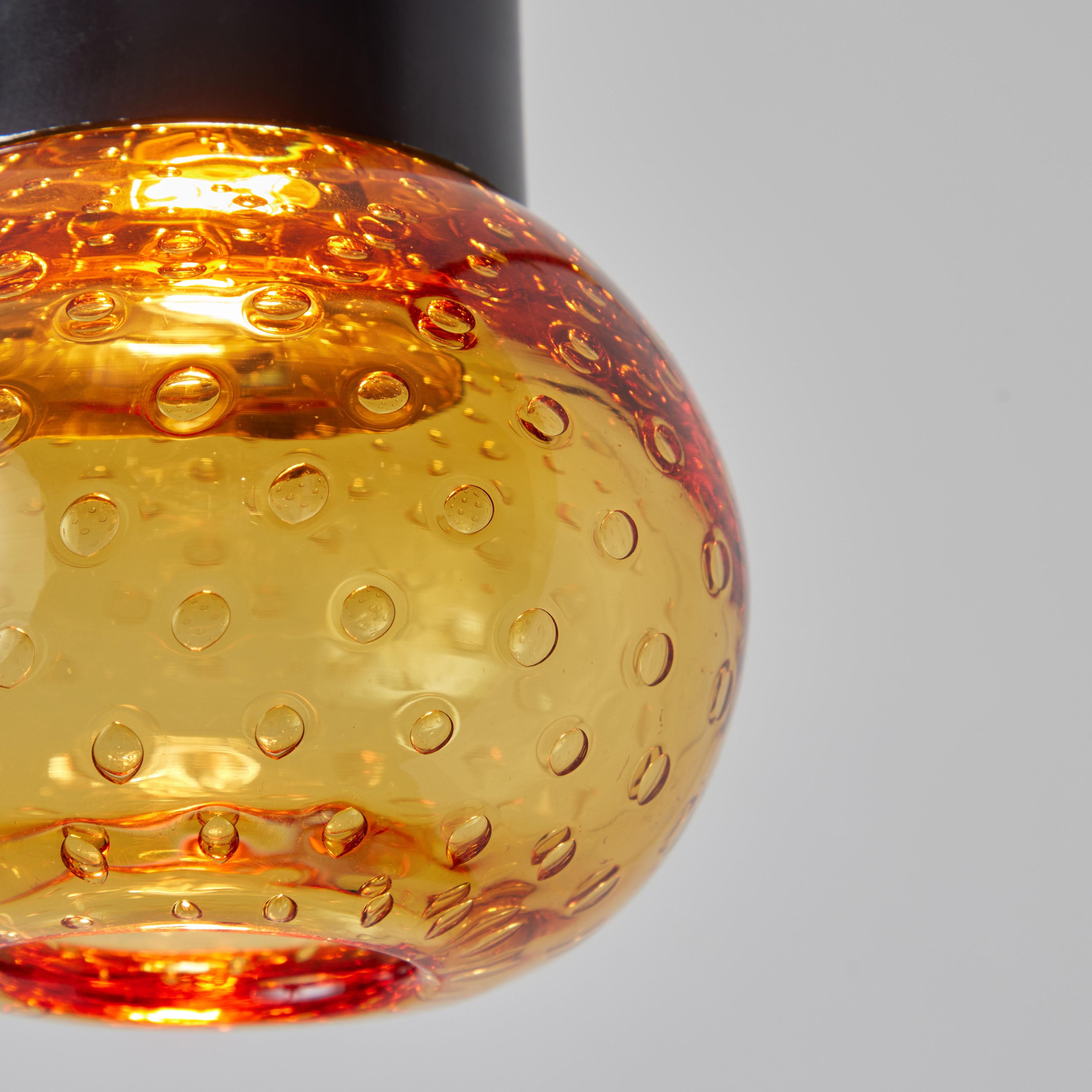 1960s Gino Sarfatti Metal and Amber Seguso Glass Pendant for Arteluce. Executed in hand blown deep amber bubbled Seguso glass and painted metal. The simplicity of Sarfatti's design and the sculptural shaping of the materials make for an incredibly
