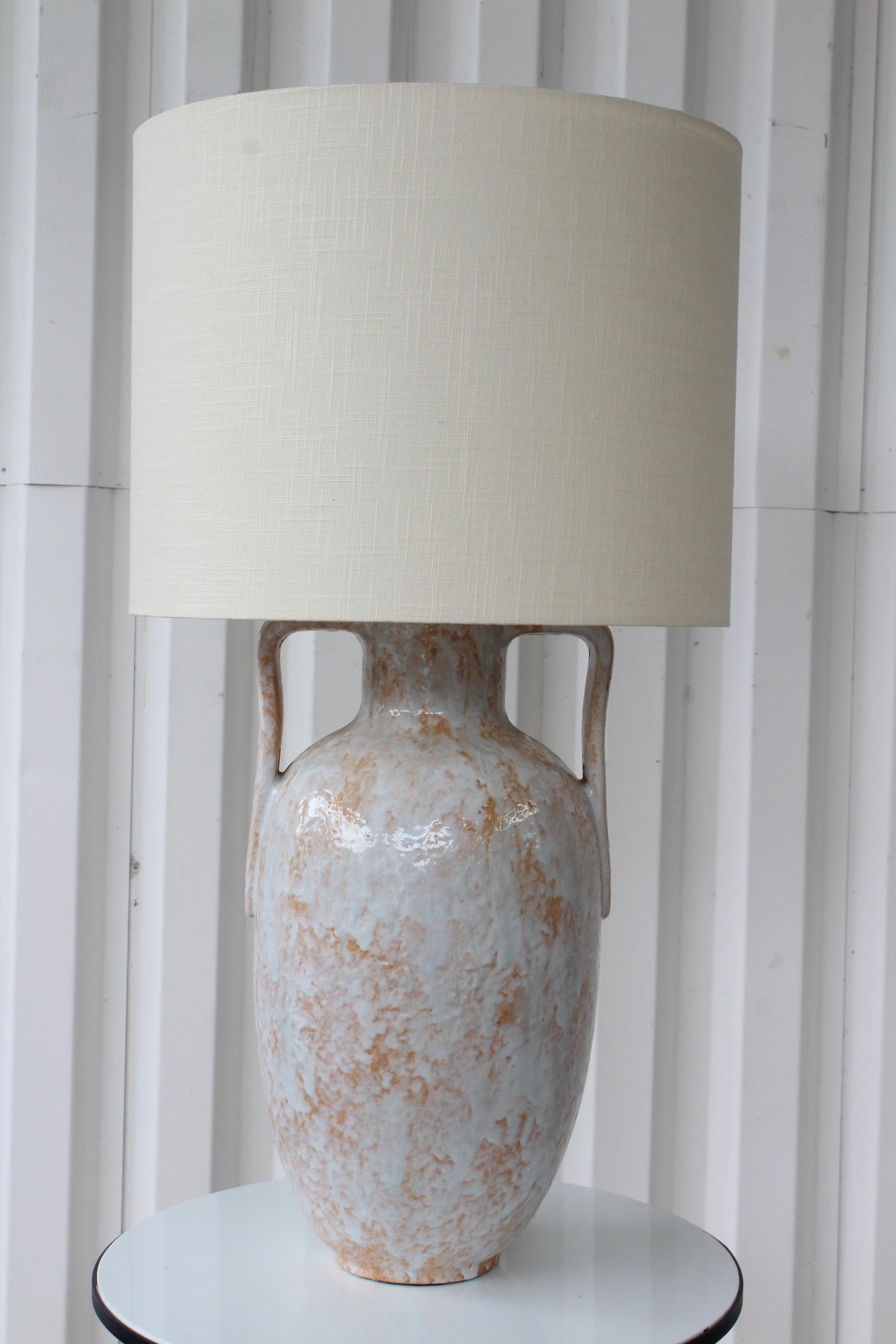 Unique glazed ceramic lamp from the 1960s. Newly rewired with a custom made shade in Belgian linen. 
12