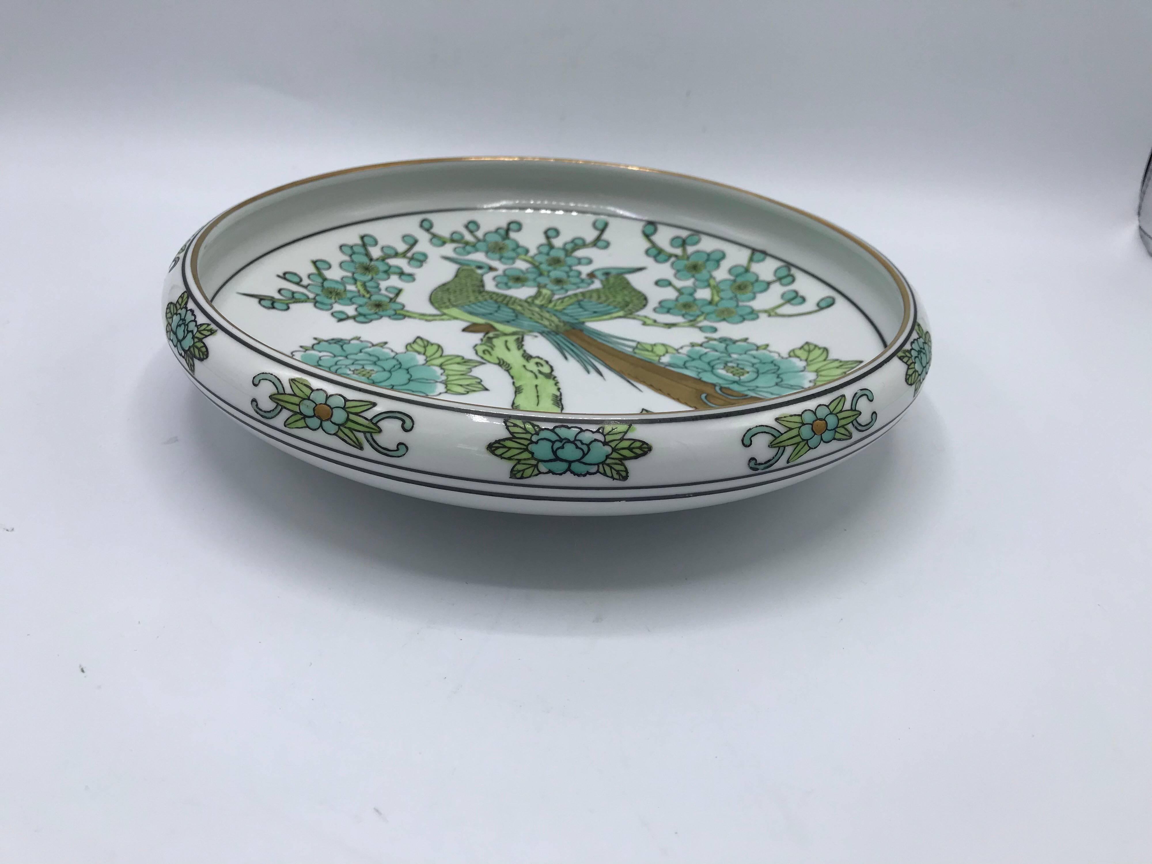 Listed is a beautiful, 1960s Gold Imari, green and white dish. The piece has a gorgeous peacock motif with gold accents. Marked ‘Gold Imari’ on bottom side.