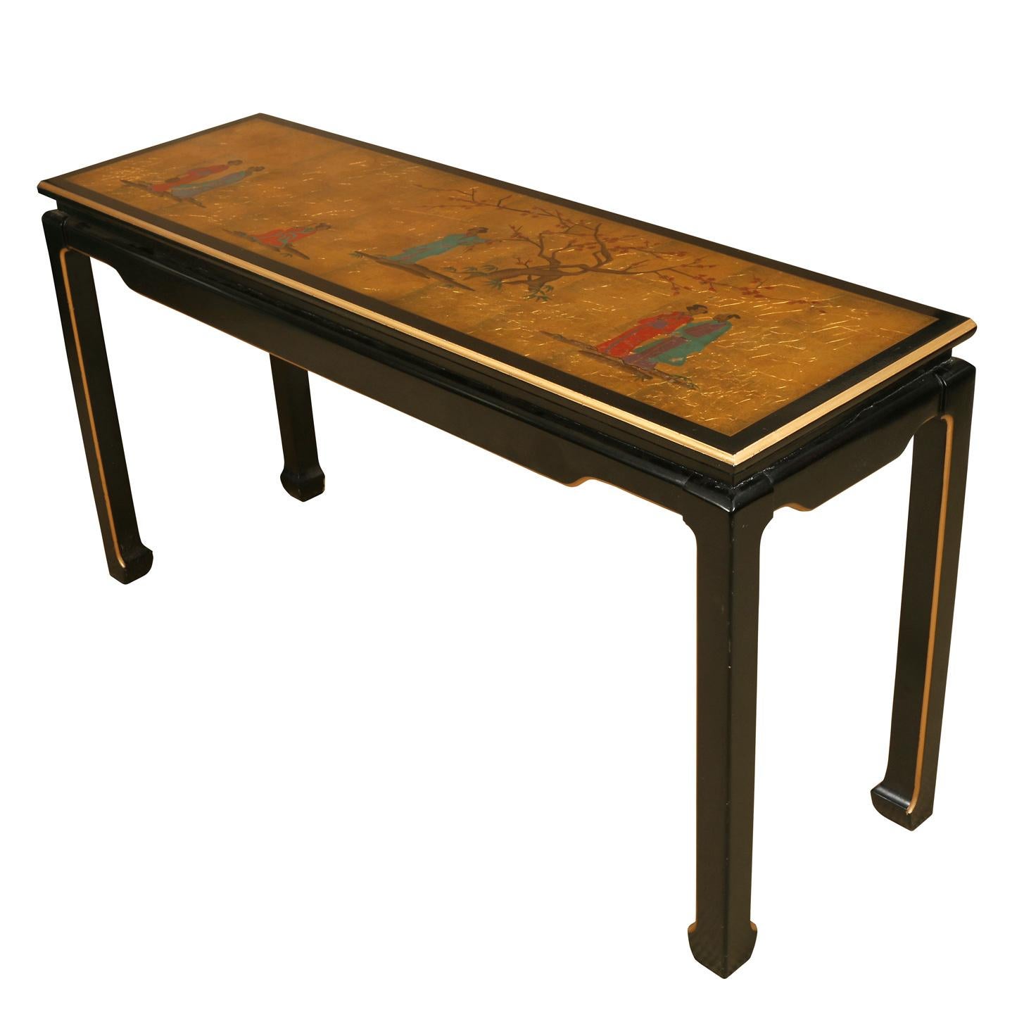 Gold leaf Asian console, circa 1960, with figures and garden landscape decoration to top. Table is ebonized with gold trim to legs.
