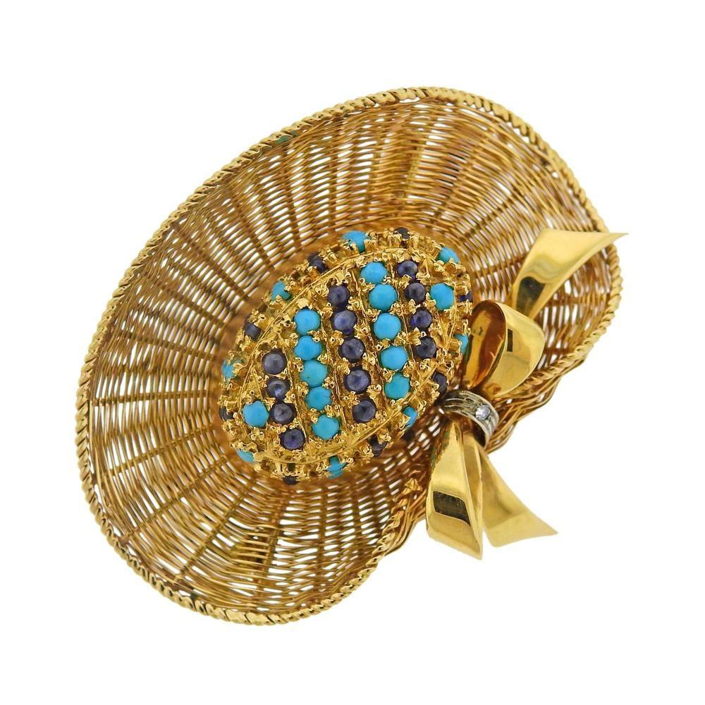Vintage circa 1960s 18k gold sun hat brooch, decorated with diamonds, turquoise and sapphires. Brooch is 51mm x 44mm. Marked 750. Weighs 31 grams.