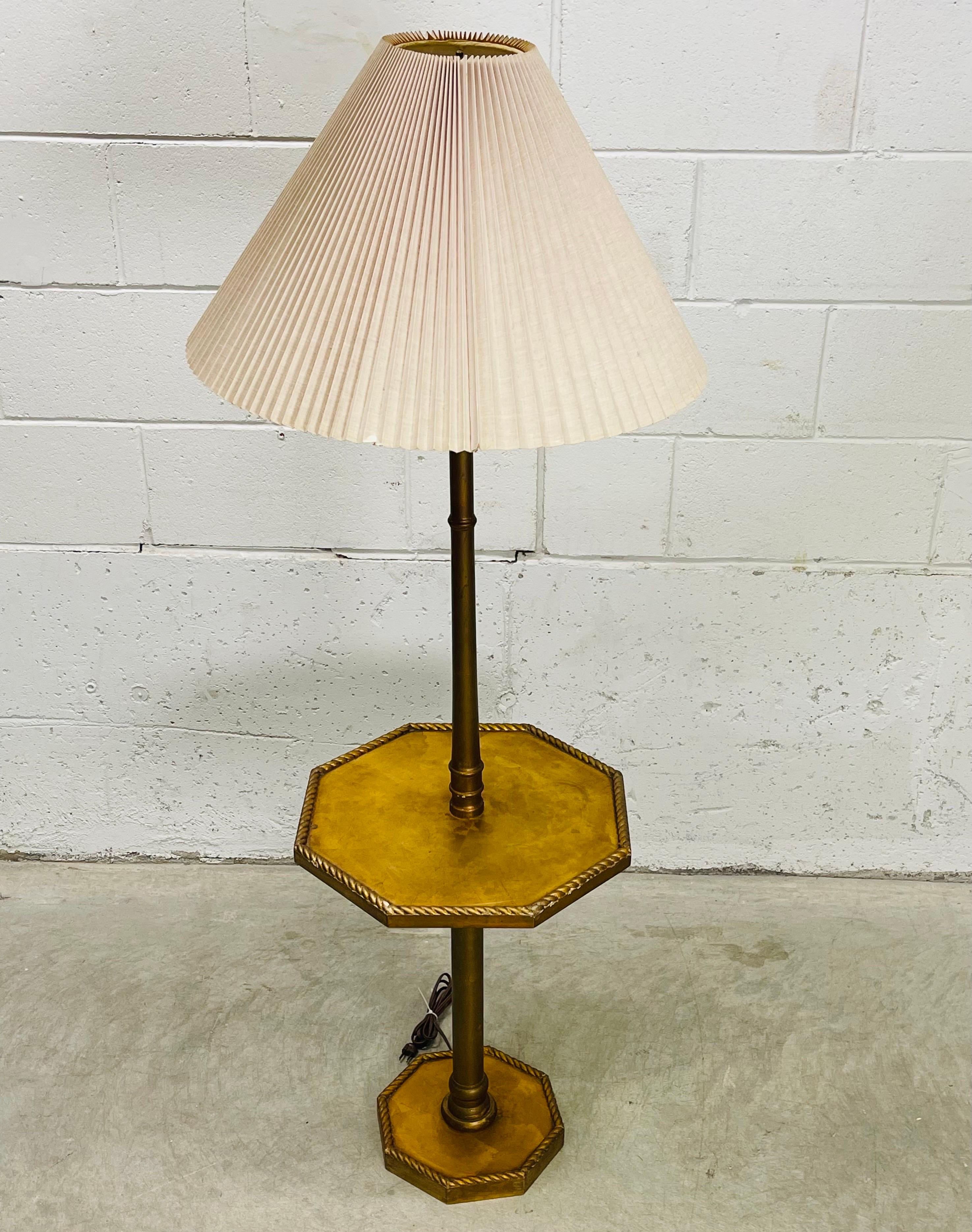 Vintage 1960s gold wood floor lamp with 6 sided table and original shade. The lamp also has a rope accent around the table and the base. Wired for the US and in working condition. Uses a standard 100W bulb. Shade, 21”Diameter x 14” H. Socket, 46” H.