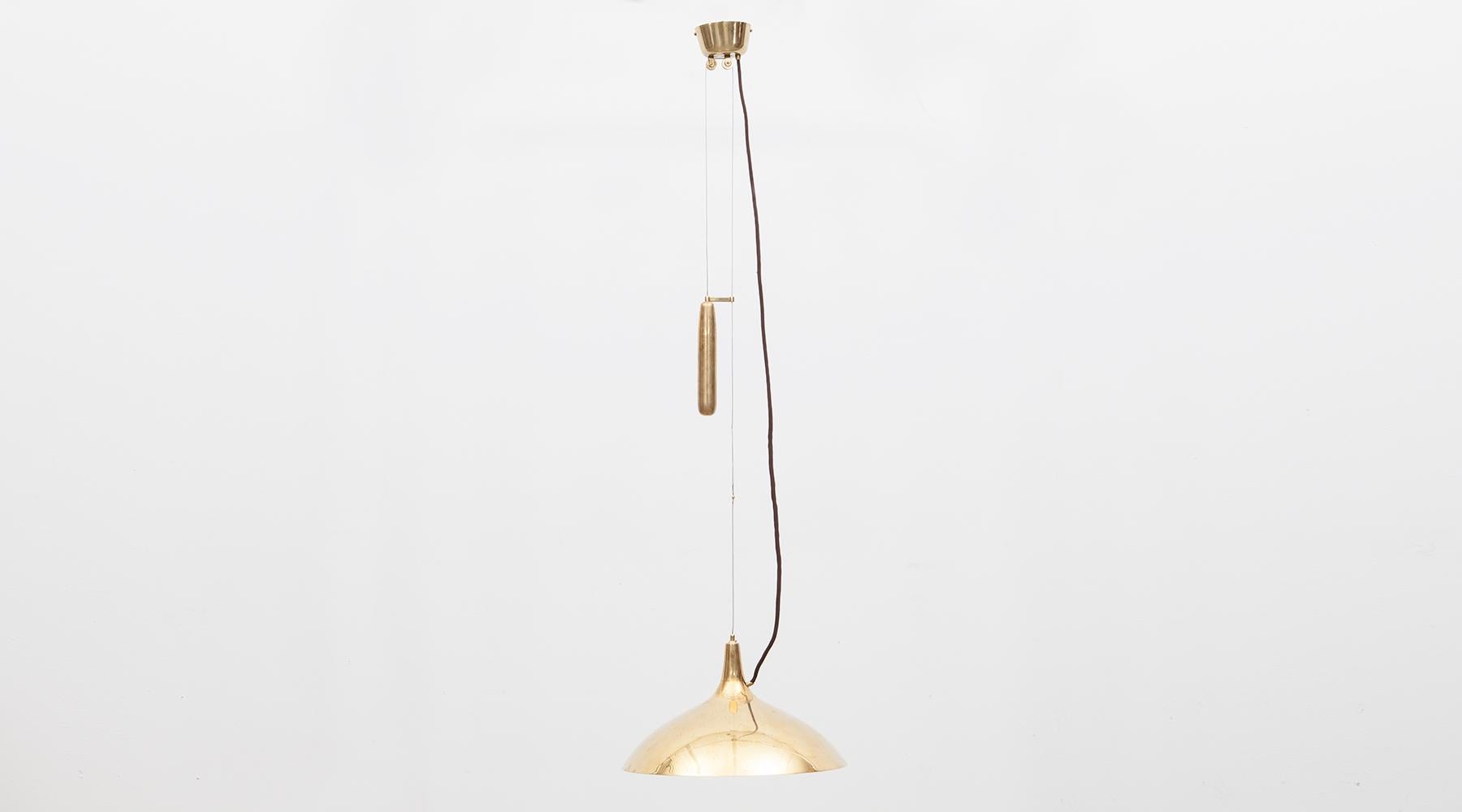 Brass and etched glass, ceiling lamp by Paavo Tynell, Finland, 1965.

Very elegant counterweight pendant designed by famous Finnish Paavo Tynell in brass, tapered with etched glass cover, giving a warm charming light with large brass balance, to