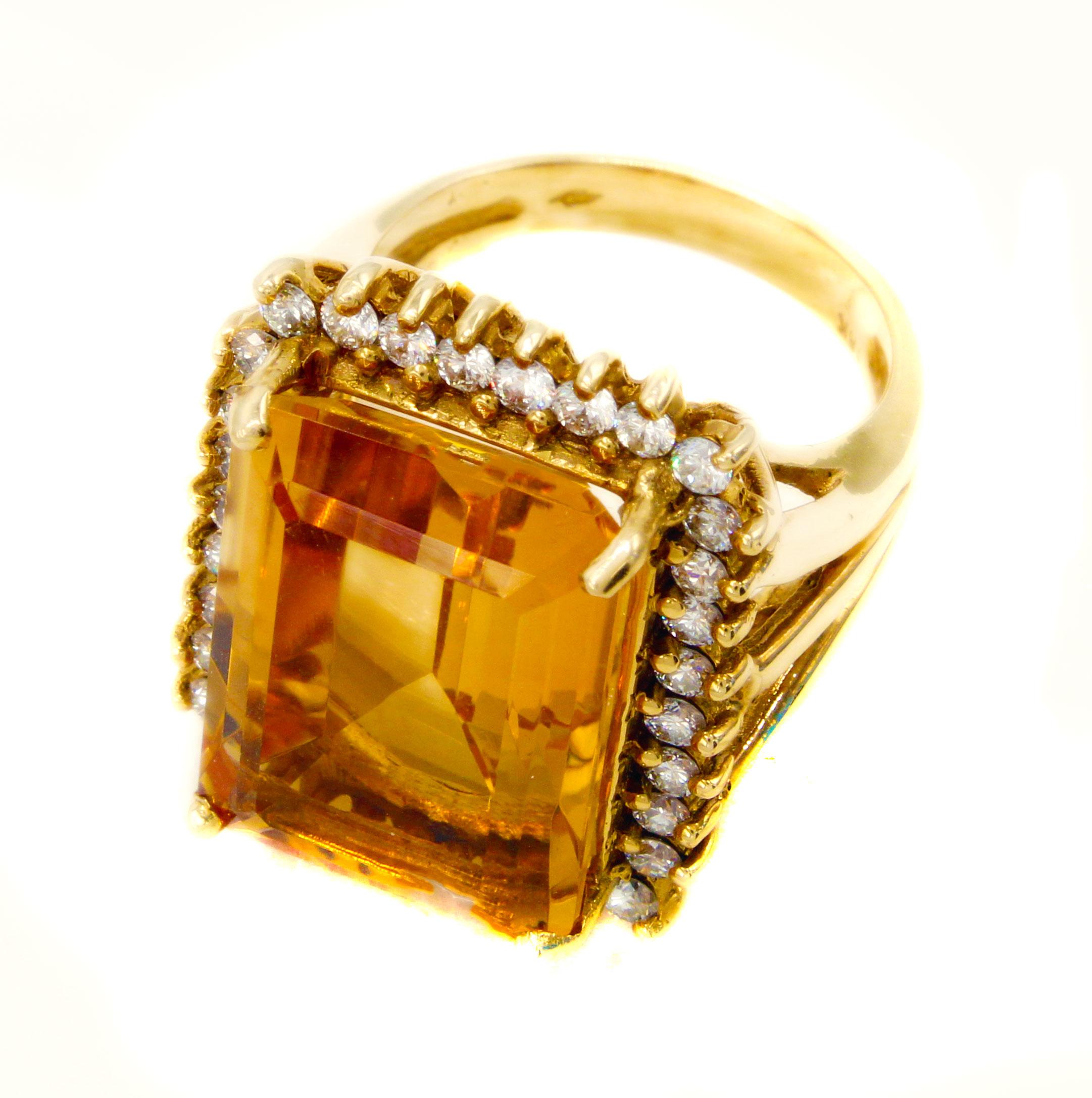 This magnificently 18 karat gold 1960s ring features beautiful lively golden Citrine, measured to weigh approximately 14 carats. The perfectly cut and proportioned emerald cut gives this gemstone an amazing fire and life. It is securely held by for