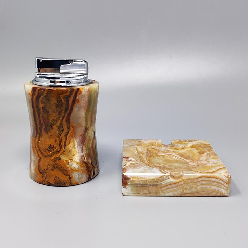 1960s Gorgeous smoking set in onyx. The table lighter works perfectly. Made in Italy. The items are in excellent condition.
Dimension:
Table Lighter
diameter 2,36