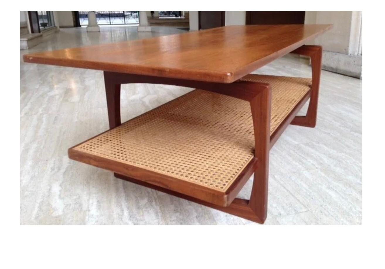 Rare Well designed large Scandinavian style design 
From late 1960 early 1970 featuring a teak top afromosia gated square legs and a floating fully in tact rattan design Lowe shelf . 