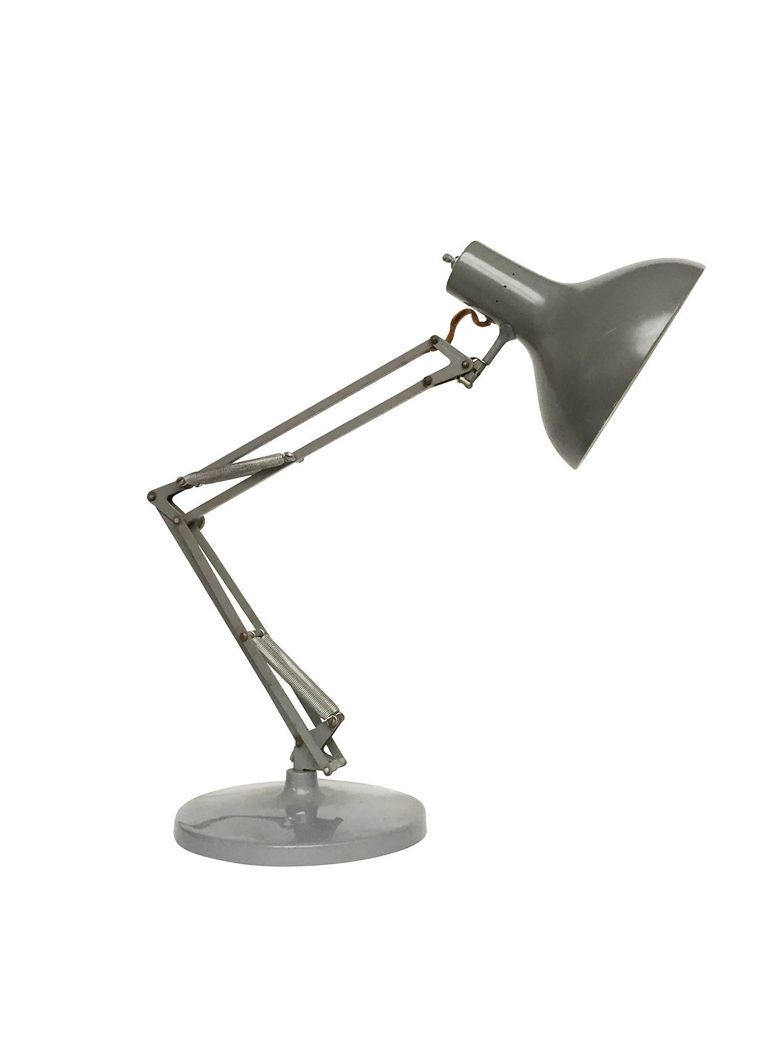 This iconic desk lamp was manufactured by Luxo in the 1960s. Its design is renowned for the lamp's various points of articulation, which allows it to be positioned in multiple ways as well as extend its reach. This is a fine lamp with its original