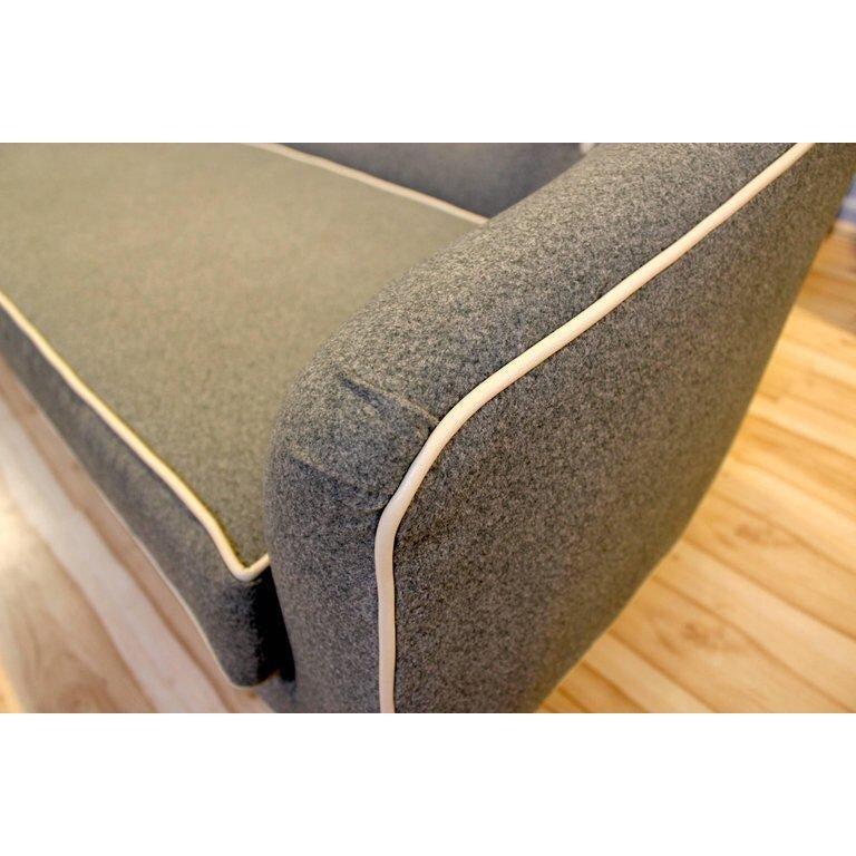 1960s camelback sofa, professionally reupholstered with new material in gray felt with contrast welting and buttons. 

Width: 86 in / Depth: 33 in / Height: 30.5 in / Seat Height: 17 in.