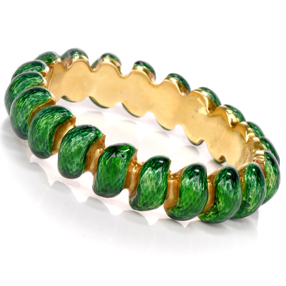 This stylish vintage enameled bangle bracelet is crafted in solid 18K yellow gold.
Displaying delicate female elegance, this bracelet features Heavy 18k gold bangel topped with green Italian enamel.
This bangle bracelet remains in excellent