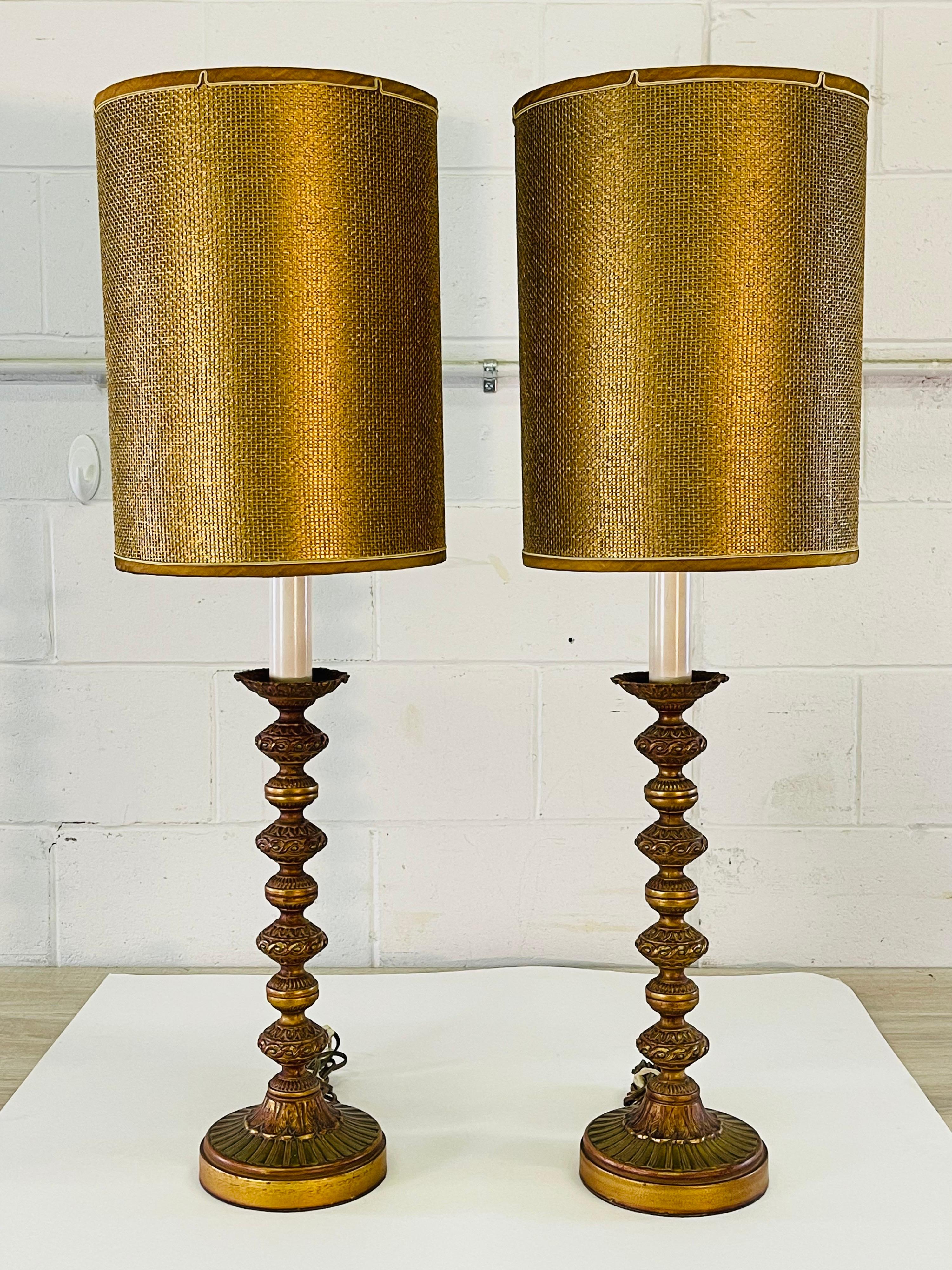 Vintage 1960s pair of green and gold metal tall table lamps with the matching original shades. The lamps are wired for the US and in working condition. These lamps can use a 3-way bulb. Socket, 24.5”H. Harp, 6.25” diameter x 12” height. The lamps