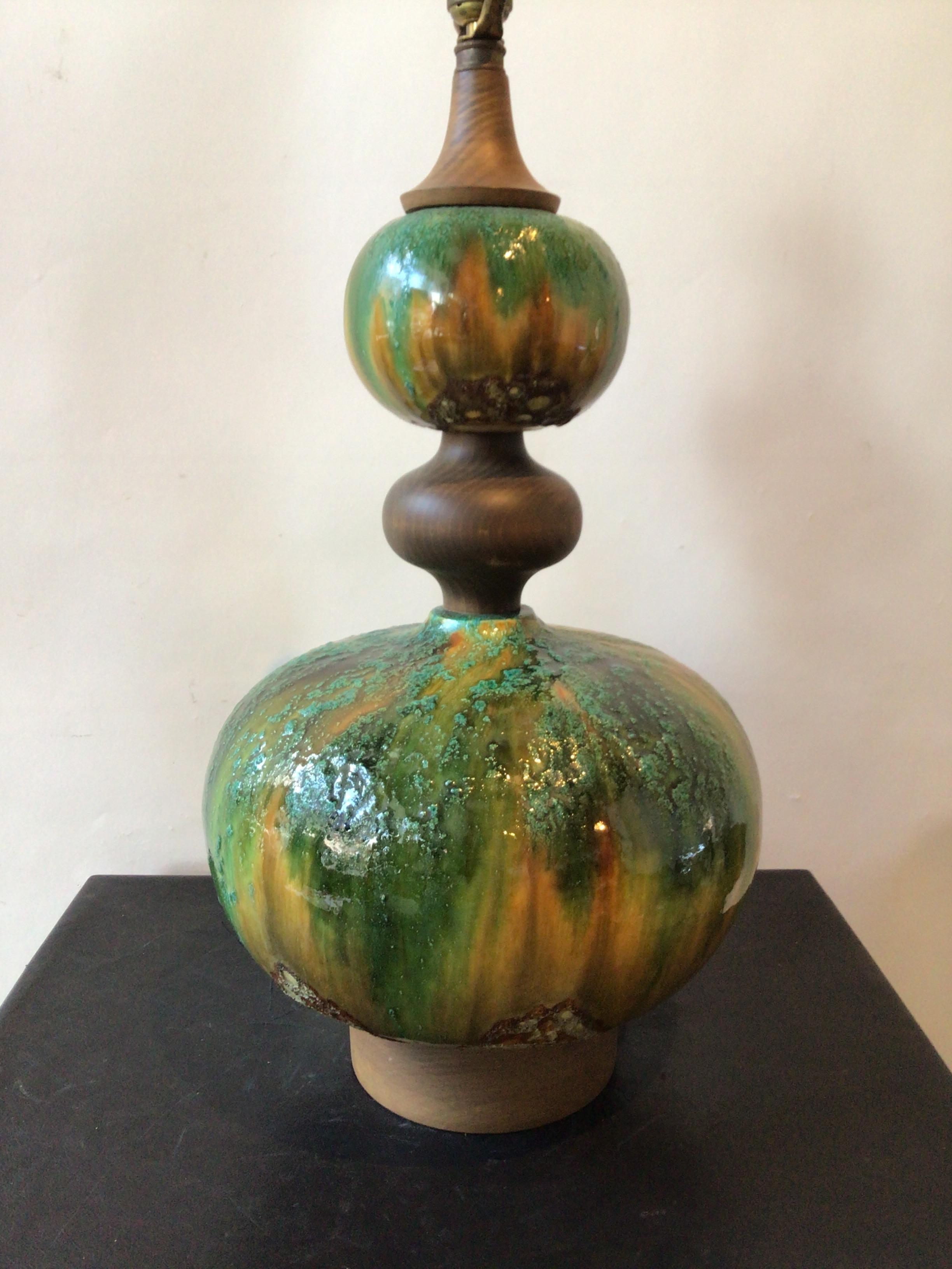 1960s textured ceramic lamp on wood base.