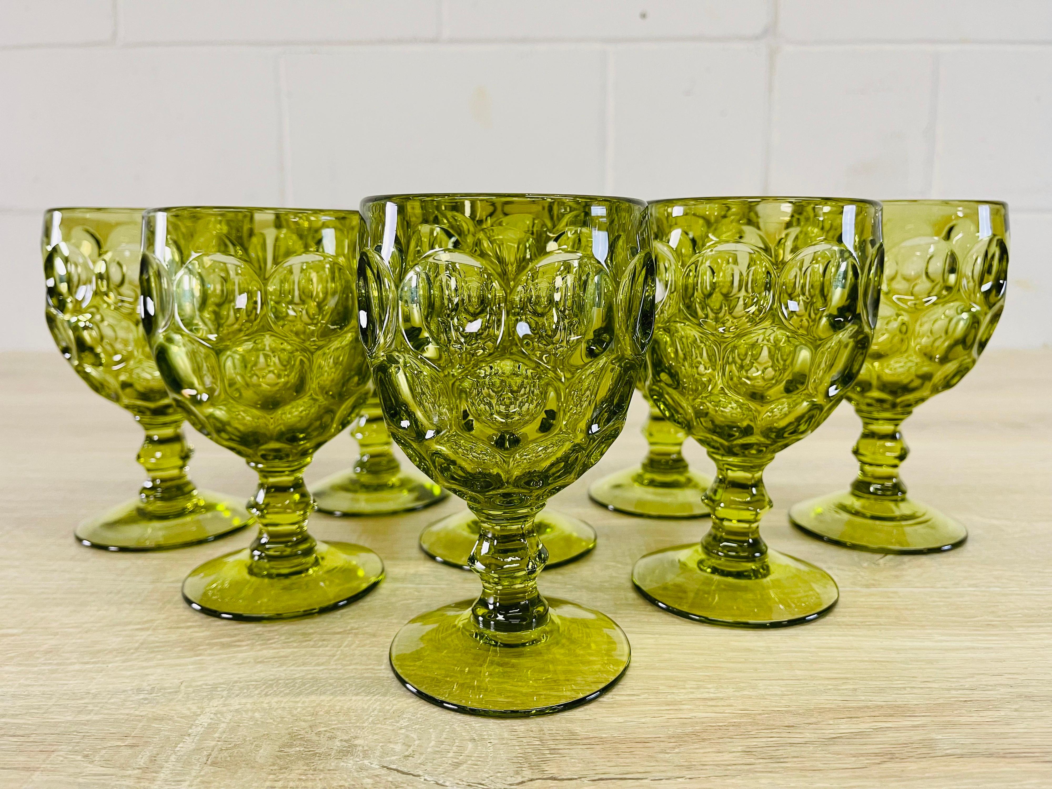 Vintage 1960s set of 8 green glass thumbprint water or wine stems. No marks.
