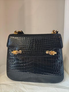 1960s Gucci Black crocodile leather gold and silver hardware shoulder bag