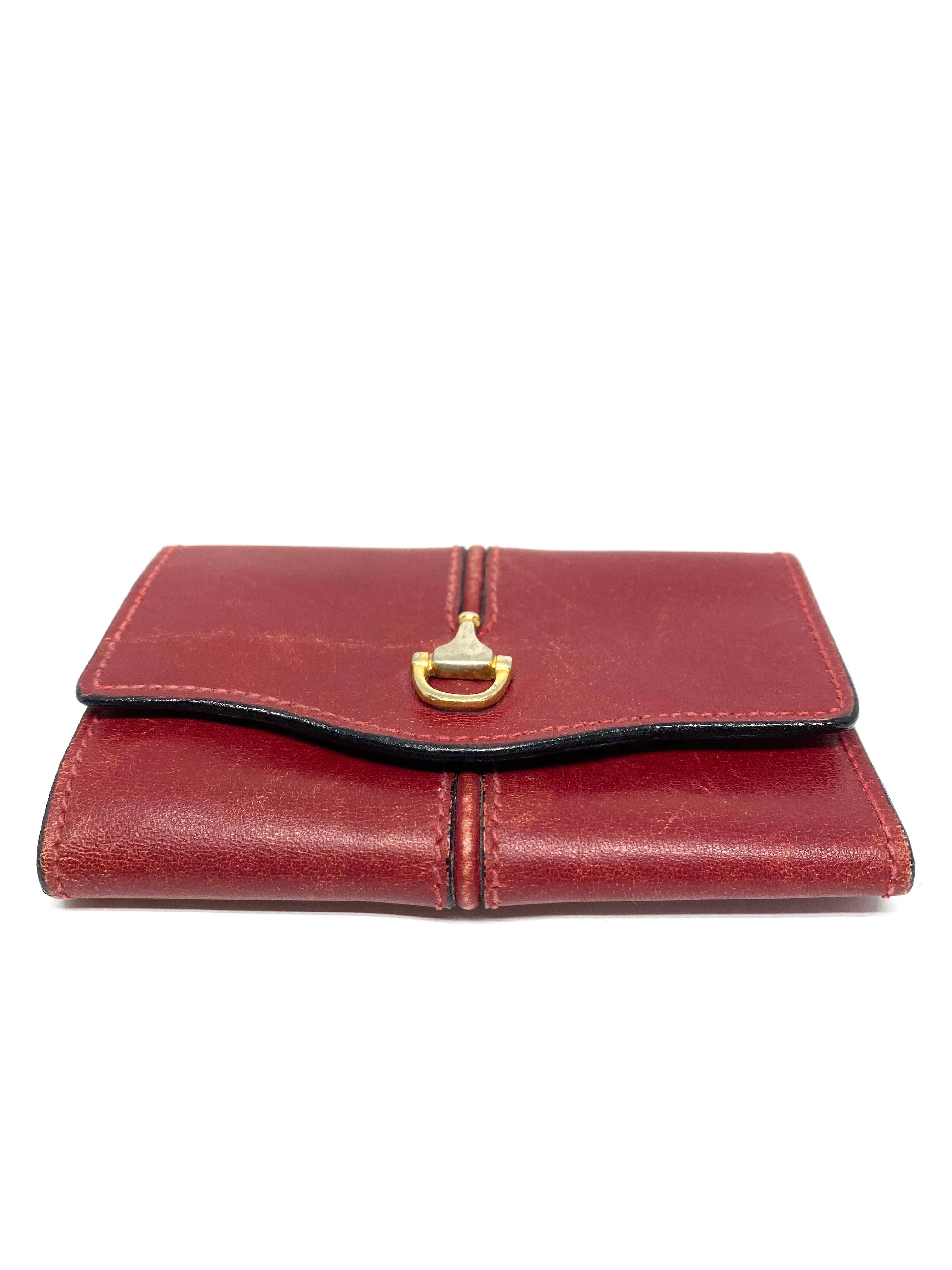 1960s GUCCI Red Leather Key Holder Wallet

Product details:
Red leather tri fold keychain wallet 
Gold tone hardware
Featuring six hooks for the keys and one pocket on the left side 
Made in Italy
