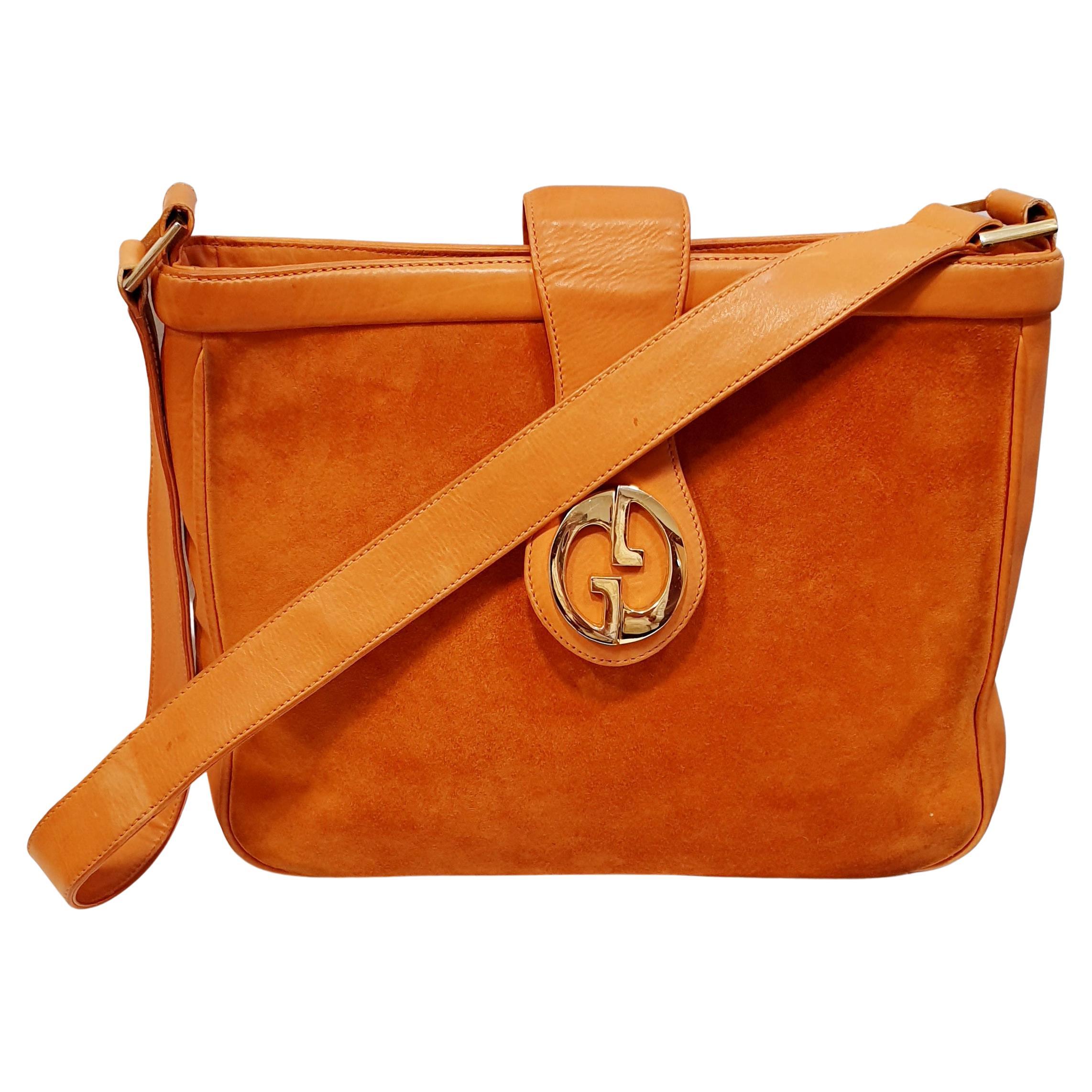 Vintage Gucci Orange Suede and  Leather Handbag With Gold G's
Material Suede and Leather
Color Orange
Length   26 cm 10,23 inches
Height   22 cm  8,66 inches


PRADERA Fashion Division  is specialised in European Fashion designers, clothing,