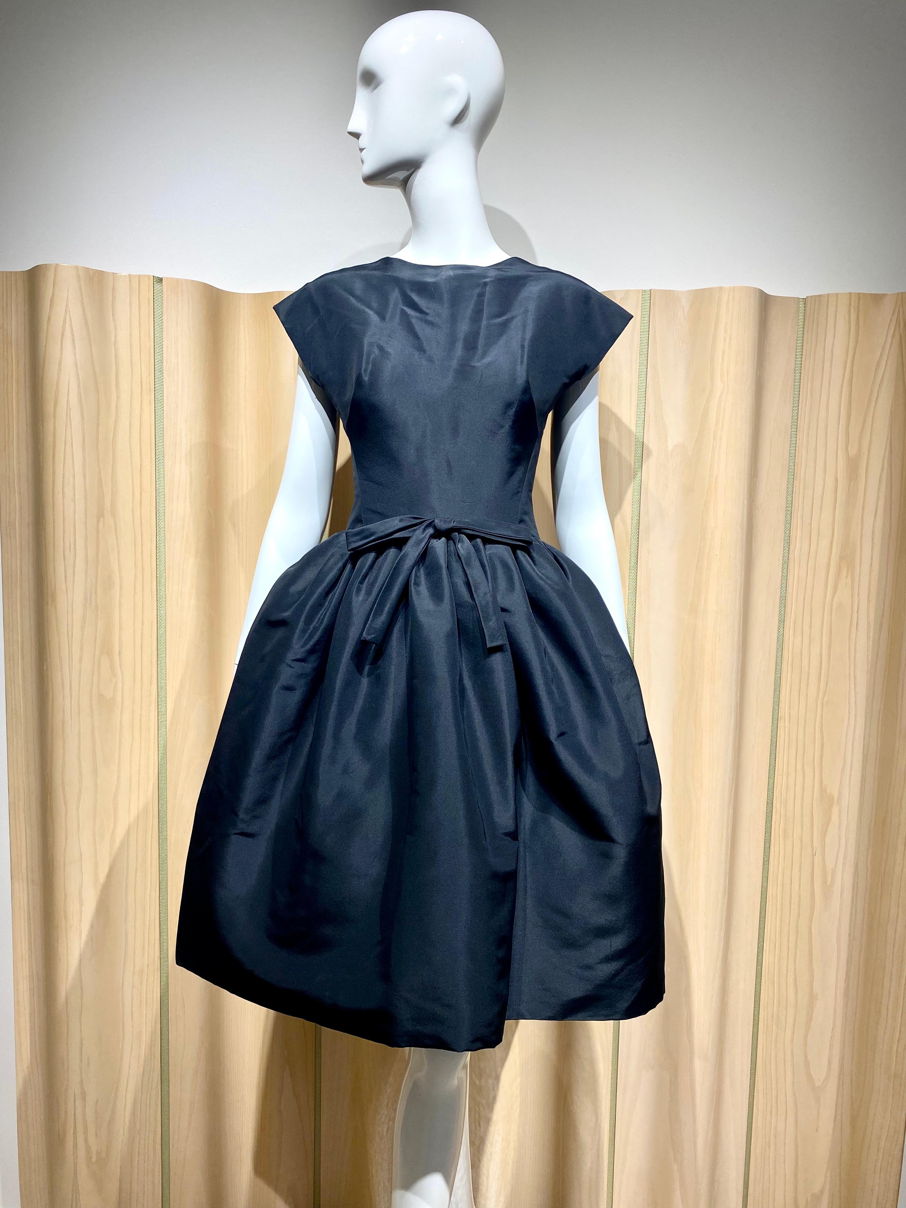 Early 60s Gustave  Tassell Black Silk cocktail Dress.
Size: 2/ XS
Measurement: 
Bust: 33” / Waist: 26”/ Hip: 44”/ Dress Length: 37”