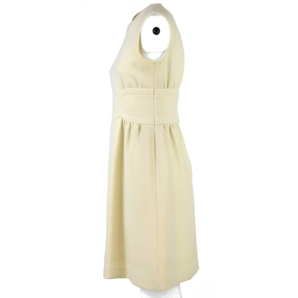Adorable Guy Laroche white short dress from the first years of the Sixties. Elegantly taken in at the waist, this dress is just as simple as exquisitely chic. Good conditions.

Measurements:
Height: 91 cm
Shoulders: 35 cm
Chest: 42 cm
Waist: 36 cm