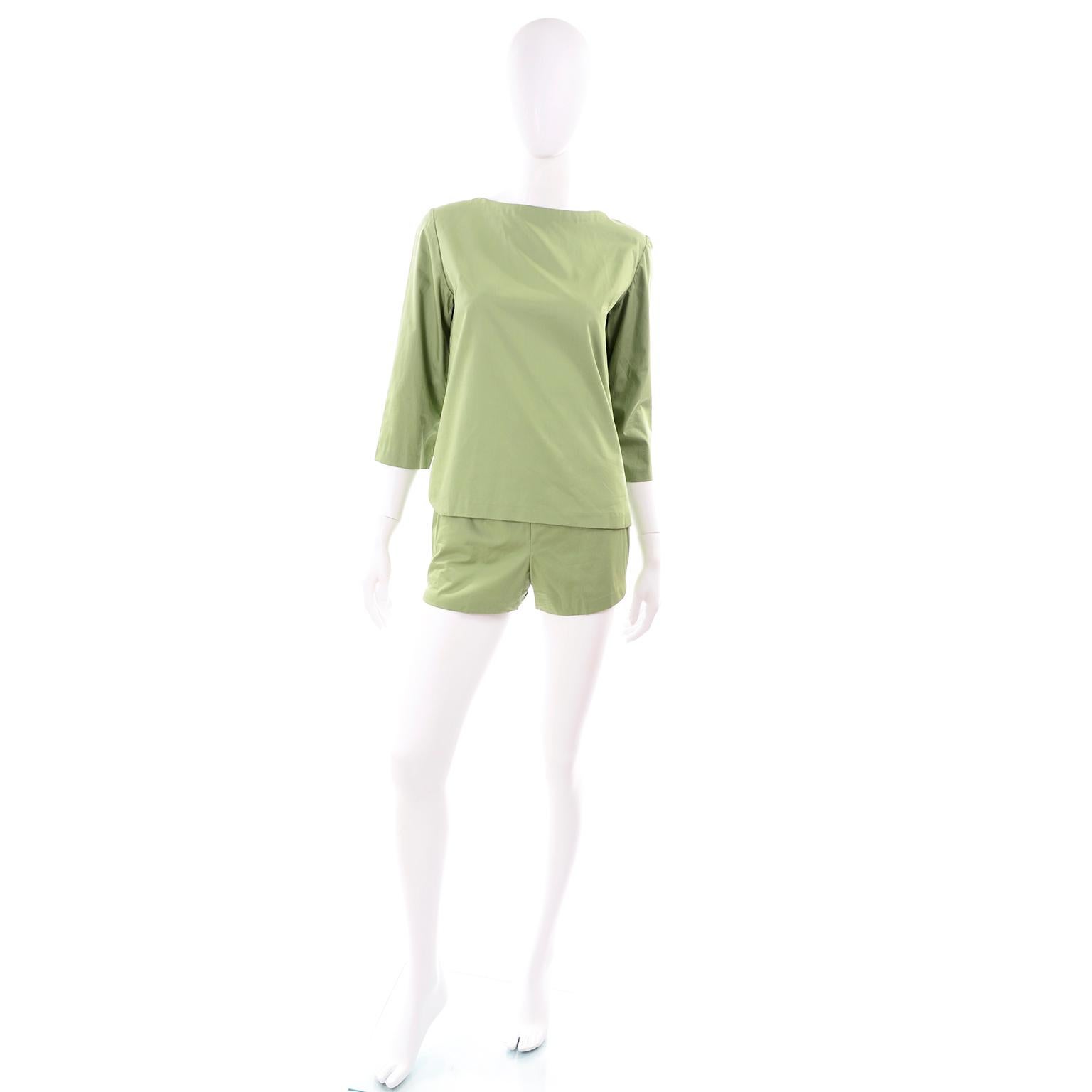 This perfectly chic H. Cosentino of Capri green cotton outfit was made in Italy in the early 1960's. This ensemble includes a 3/4 length sleeve boat neck tunic top and a pair of high waisted shorts. The outfit comes with a matching green fabric