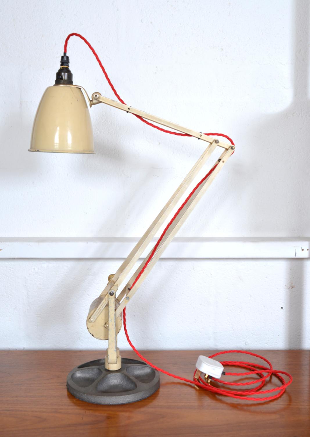 A 1960s British made counterpoised 'Roller' task lamp by Hadrill & Horstmann, which would have been originally bolted to a bench as a task lamp, whereas today it sits on a heavy cast weight, perfect for a desk lamp. The counterbalance operation is