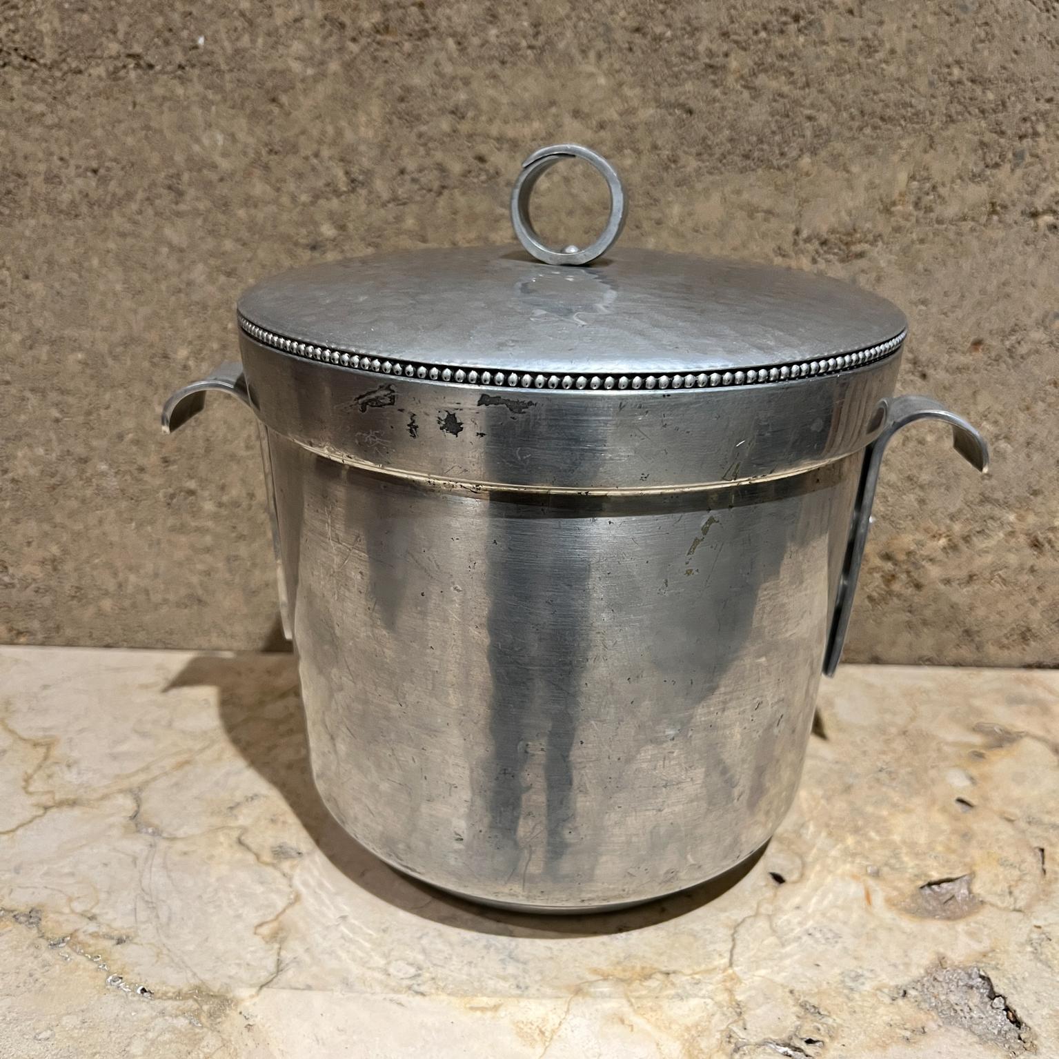 MCM BW hammered aluminum Ice Bucket with Lid
Stamped B.W. Buenilum 
8.5 h x 10 w x 8 diameter
Original vintage unrestored
Refer to images