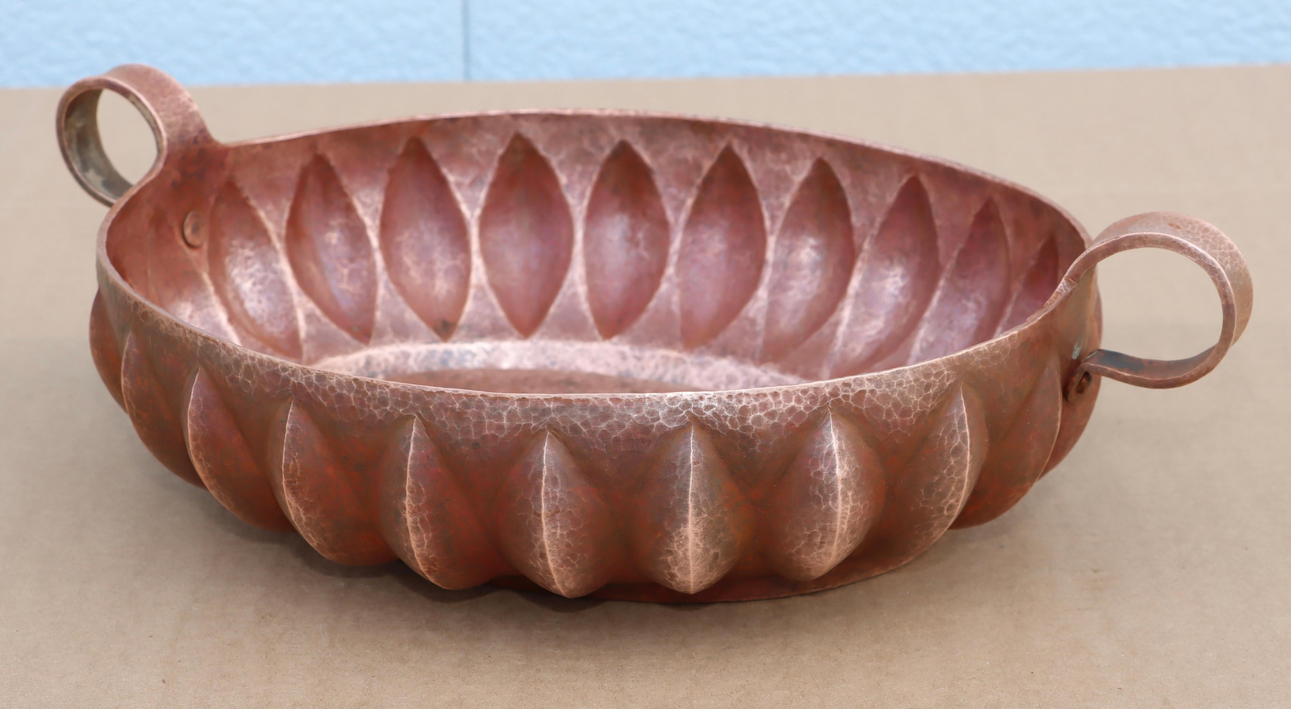 1960's modern hand hammered copper bowl from Mexico, well made and heavy signed by the artist, in vintage condition lightly hand polished with some wear and patina due to age and use.