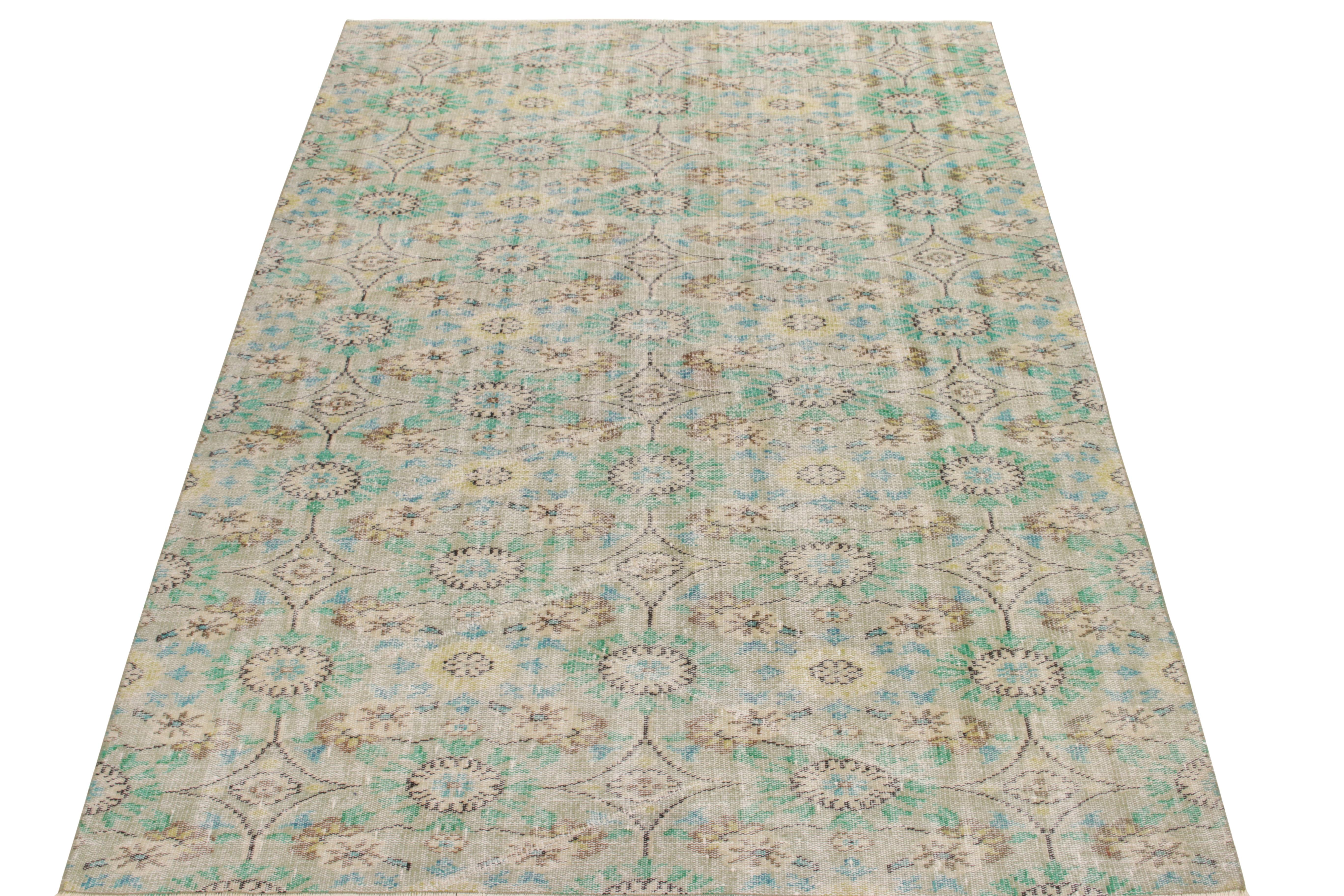 A 6 x 9 vintage rug from the workshop of a celebrated multidisciplinary Turkish designer, among the latest to join Rug & Kilim’s Mid Century Pasha collection.The gorgeous interplay of teal, aqua blue & gray complements the distress on the fine