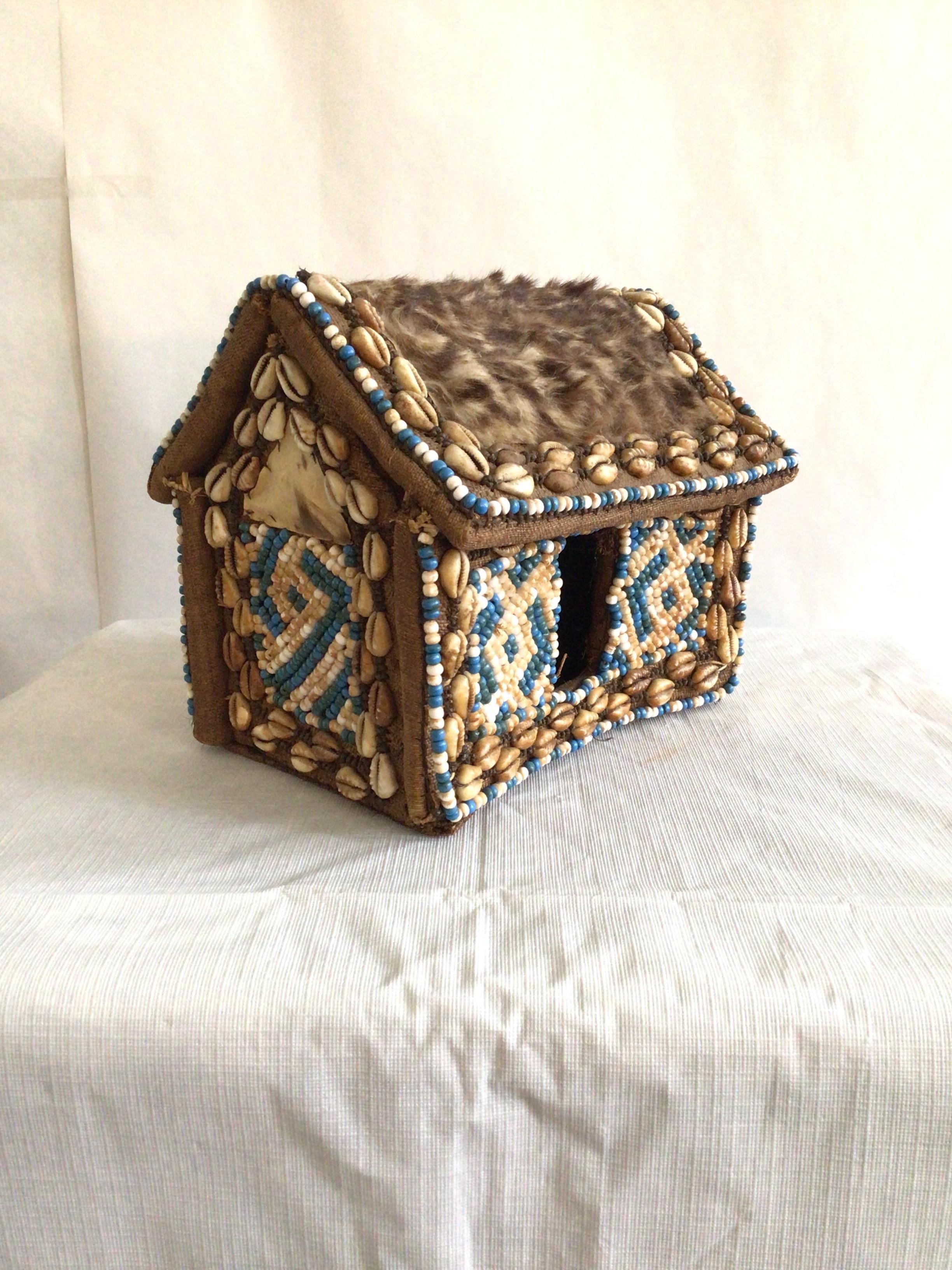 1960s Hand-Made African Tabletop Hut with Cowry or cowrie Shells, blue and cream Beading, fur, and fabric.