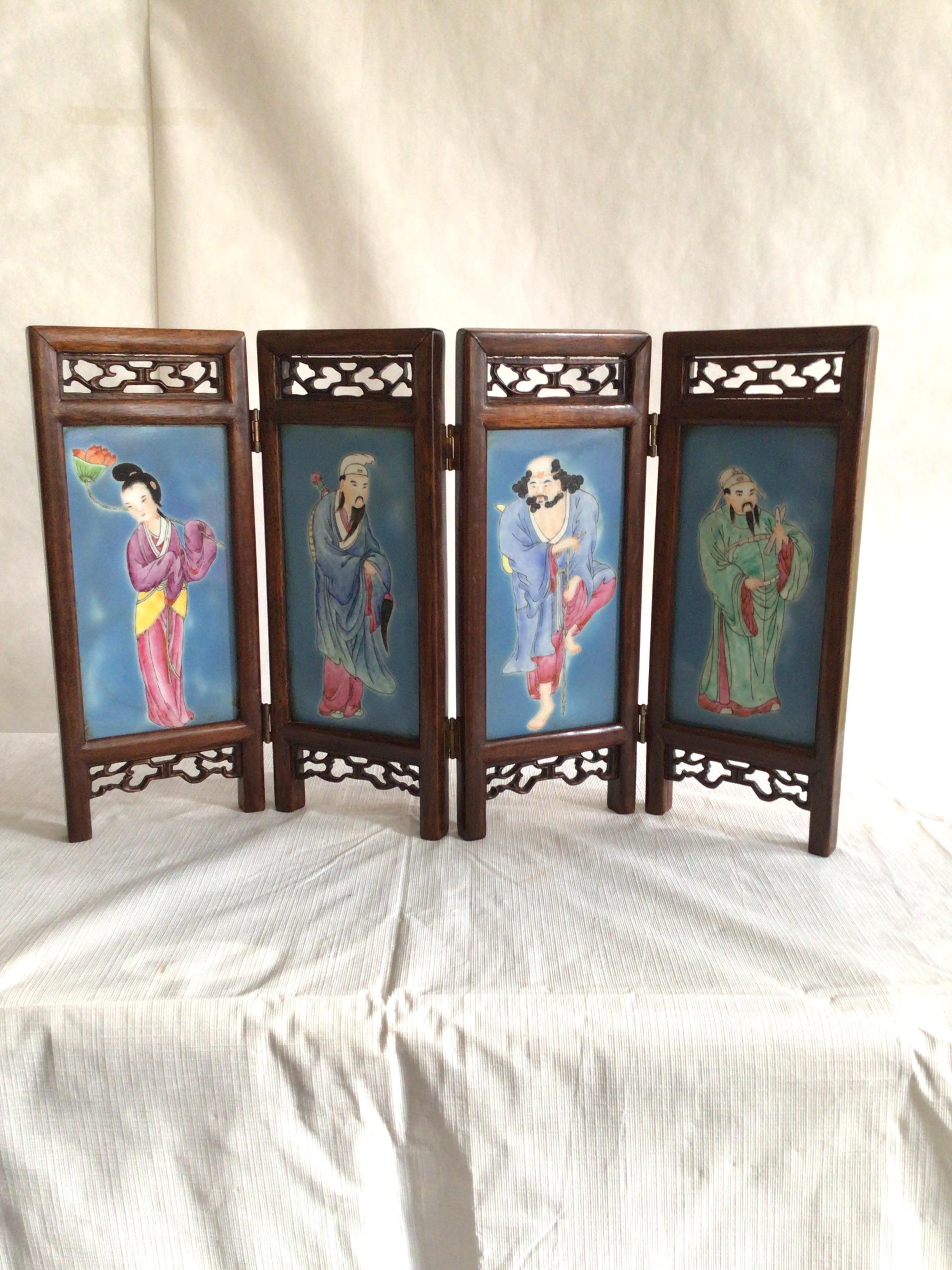 1960s hand-painted wood and porcelain tabletop screen 
Each panel is 5” wide and has prominent colors of blue, green, pink, and yellow.
  