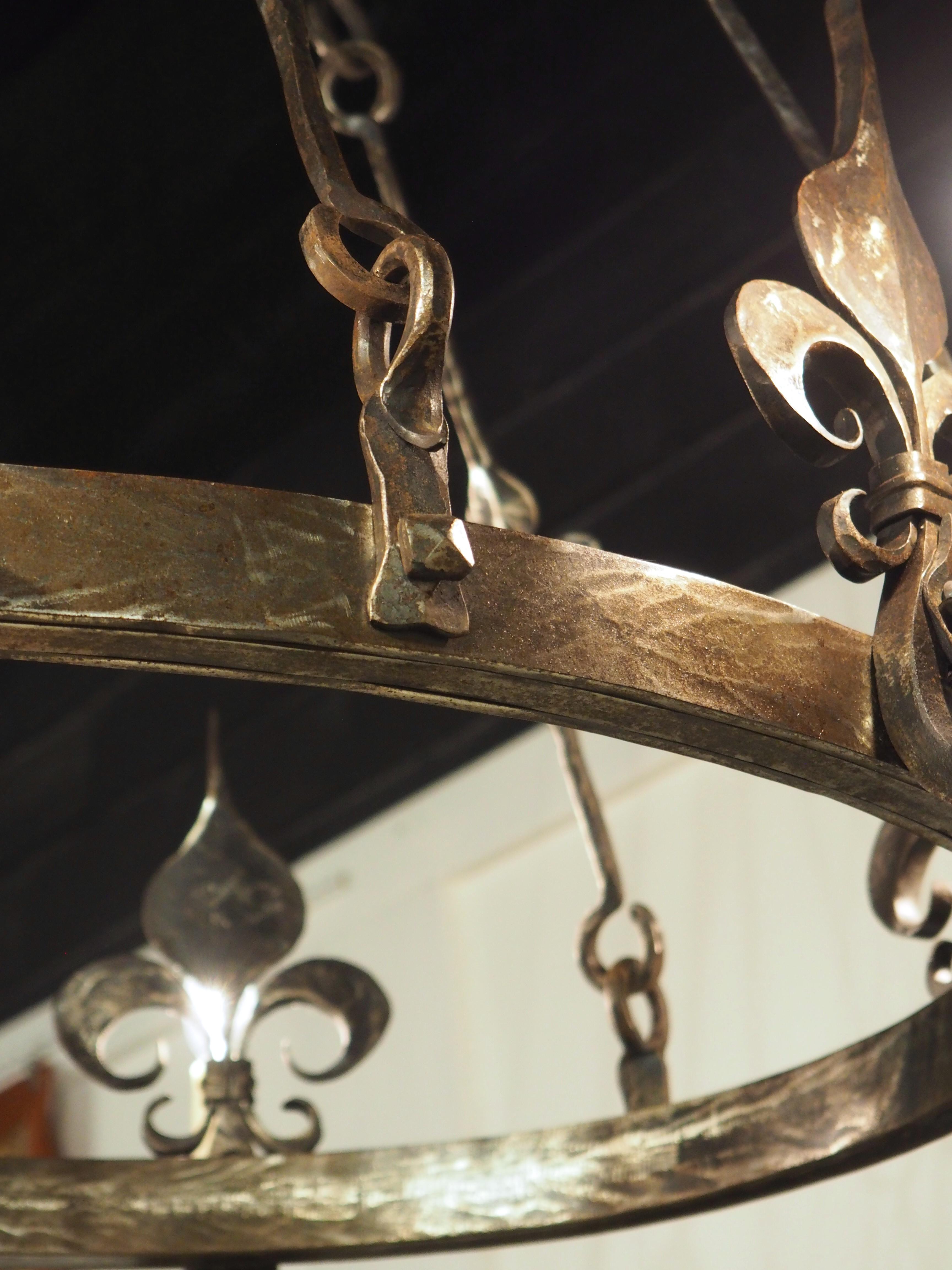 French 1960s Hand Wrought Iron Oval Fleur De Lys Chandelier from Brittany, France For Sale