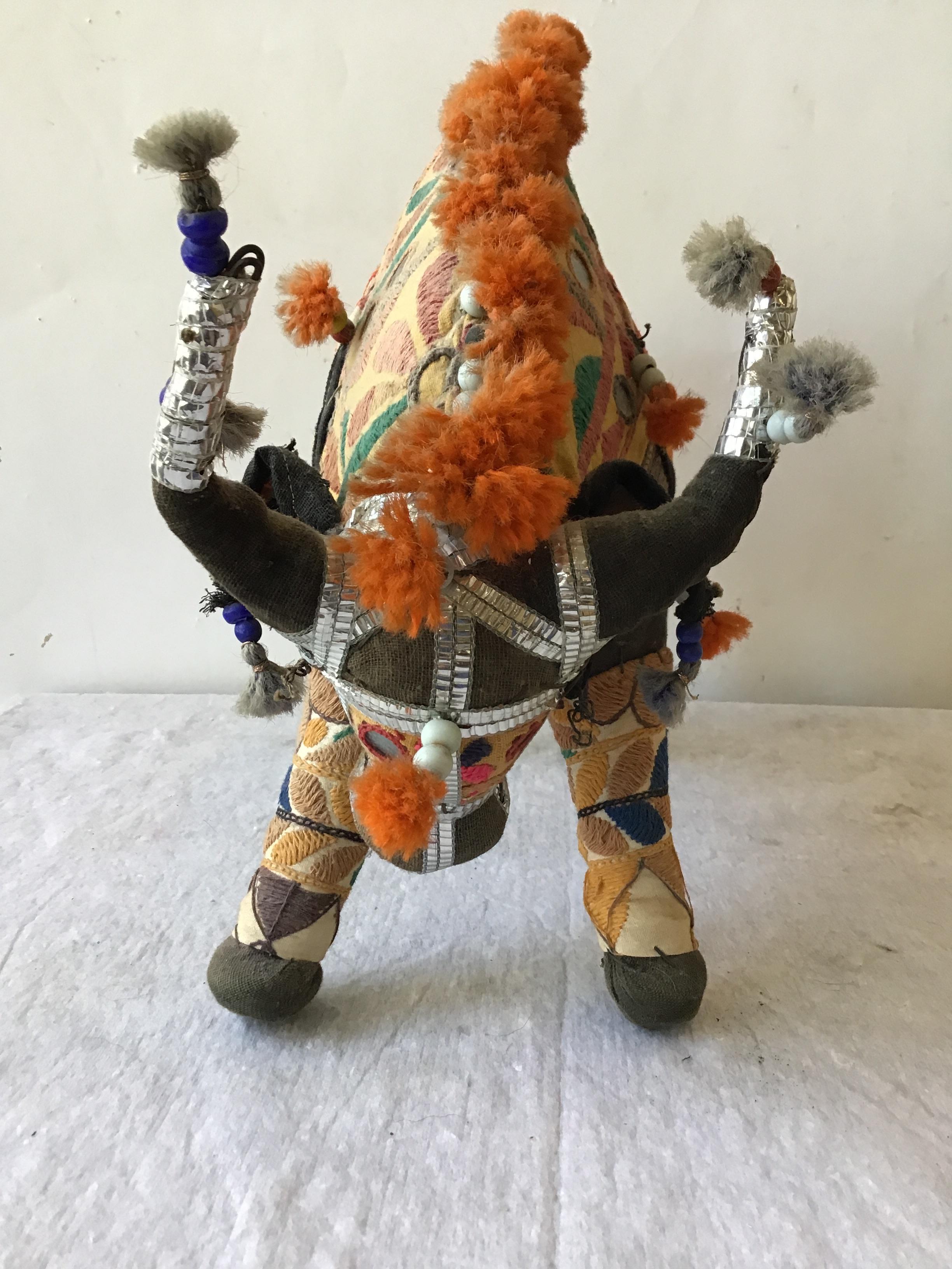 1960s handmade stuffed bull toy from India. Fabric embroidered and decorated with mirrors and beads.