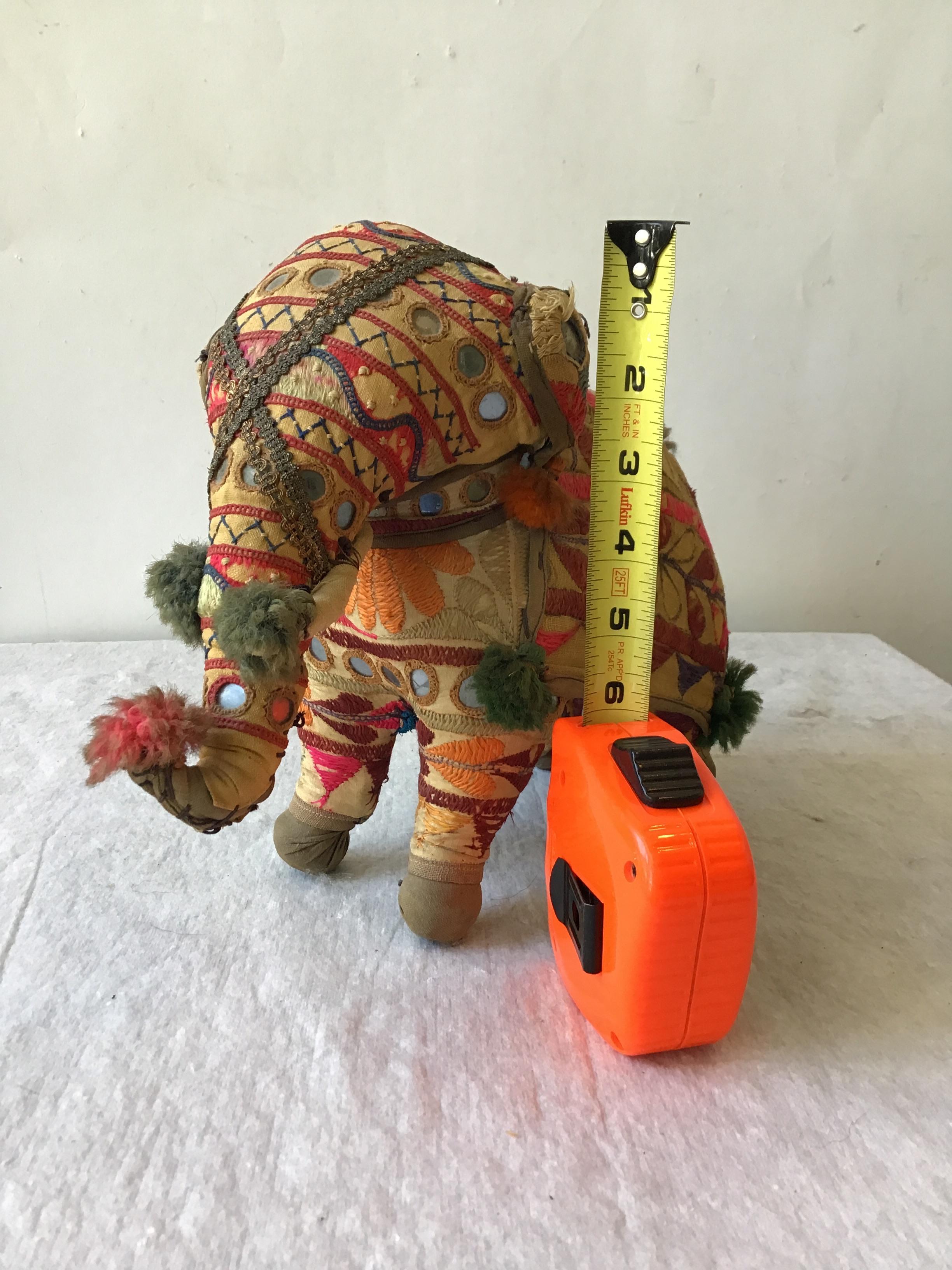 1960s handmade stuffed elephant toy from India. Embroidered fabric decorated with mirrors.