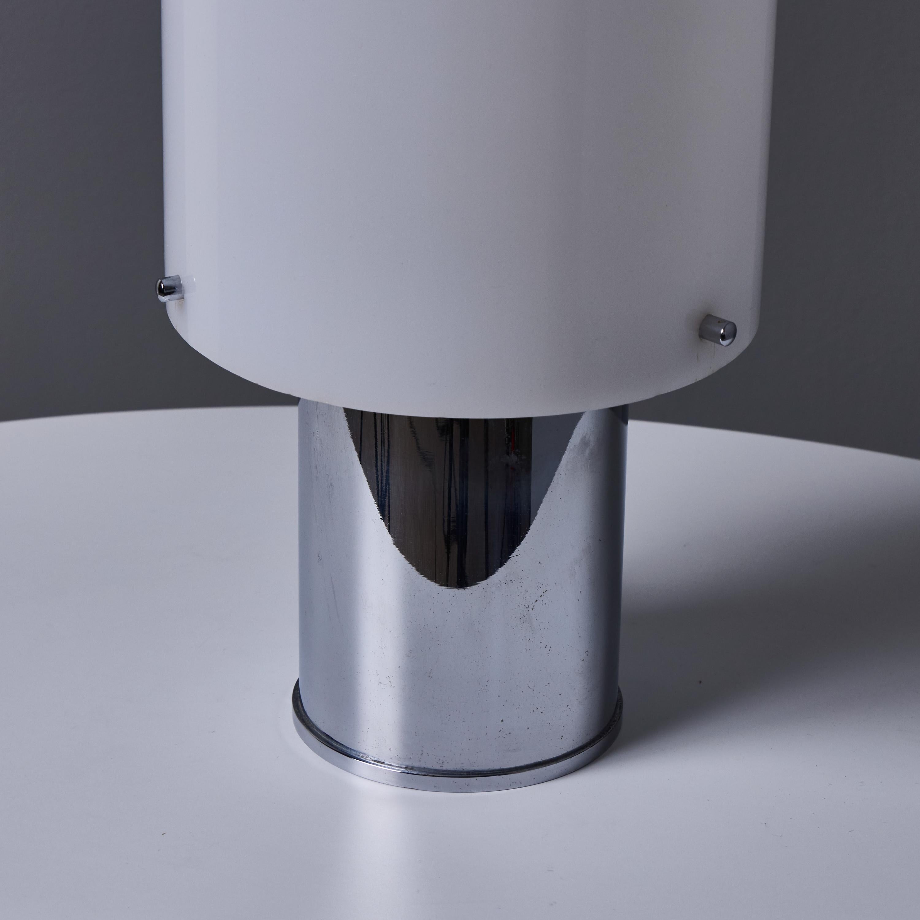1960s Hans-Agne Jakobsson Opaline Perspex and Chrome Table Lamp for Markaryd 

Executed in chromed metal and opaline perspex (acrylic). The simplicity of Jakobsson's design and the sculptural shaping of the materials make for an incredibly refined