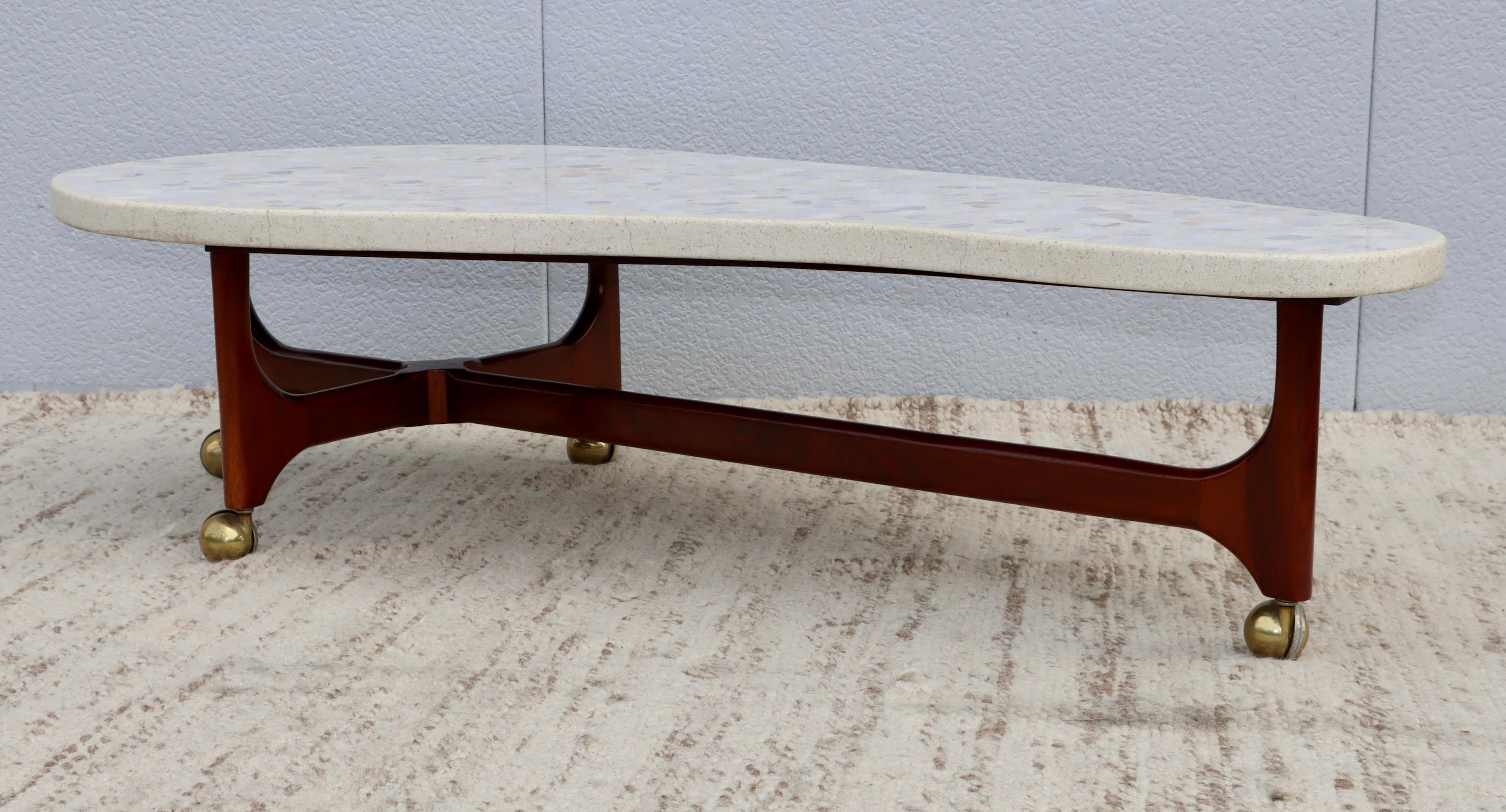 1960's mid-century modern organic shape terrazzo top with walnut base coffee table in the style of Harvey Probber, lightly restored with minor wear and patina due to age and use, there is some hairlines cracks along the edge of the top.