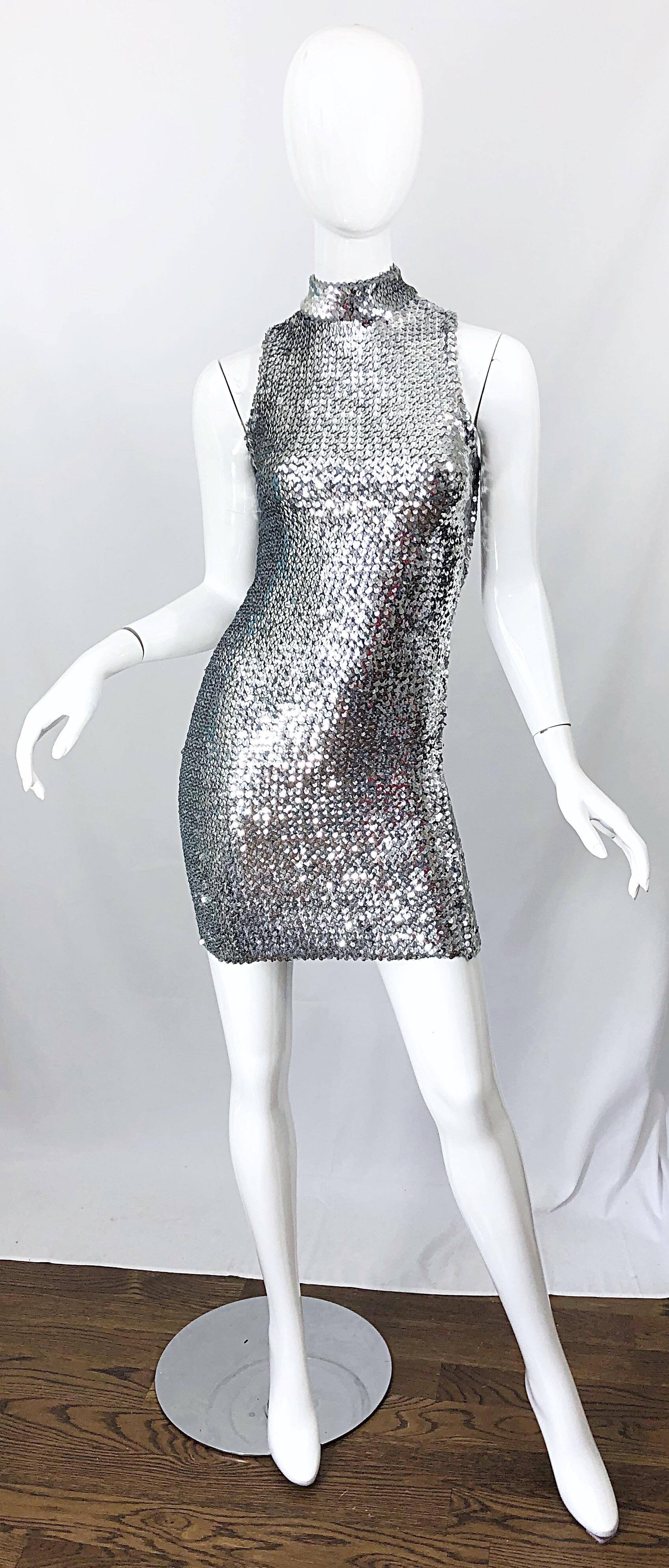 Chic 1960s HATTIE CARNEGIE silver fully sequined vintage open back mini dress! Features thousands of 
hand-sewn silver sequins throughout on a soft stretch knit. Simply slips over the head and stretches to fit. Open back has velcro closure at top