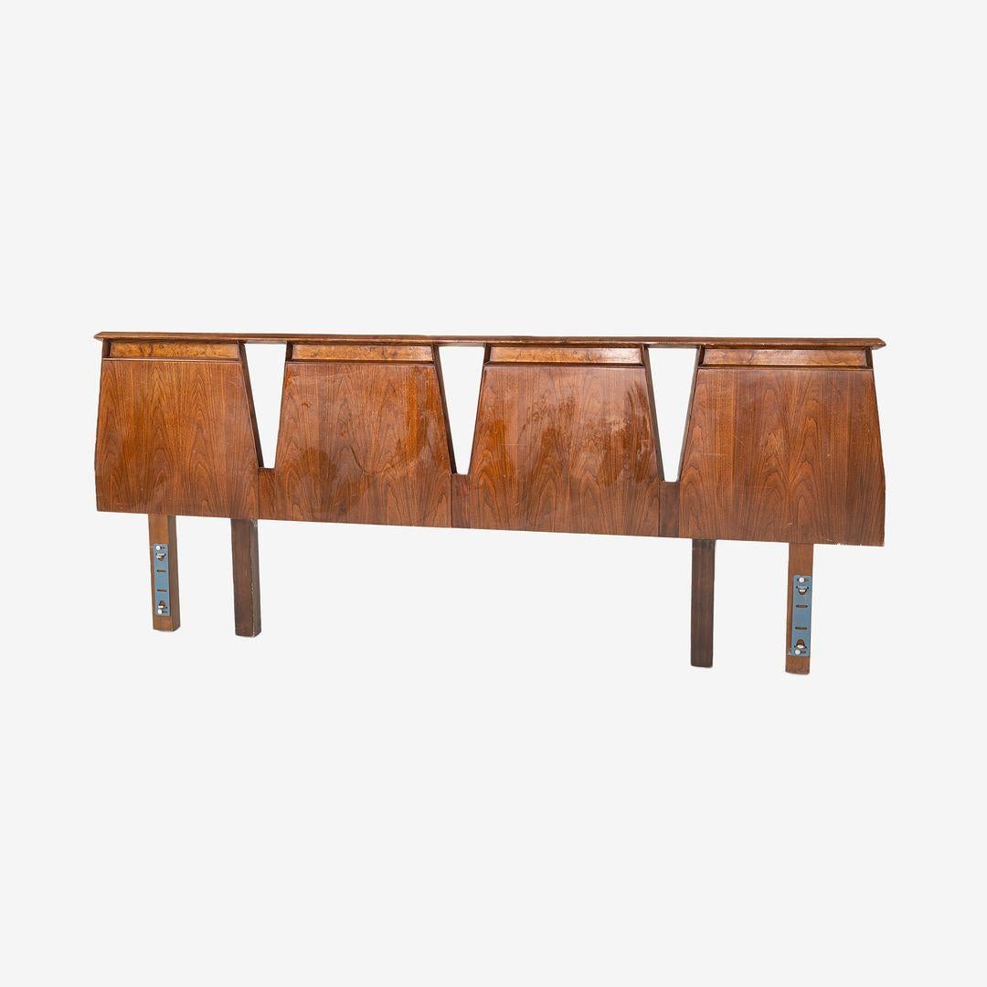 This is an impressive King Headboard in Walnut, designed by Helen and Hobey Baker in the 1960's. The husband-and-wife design team were known for their use of solid wood for their pieces, all of which were hand-built in their New York City workshop.
