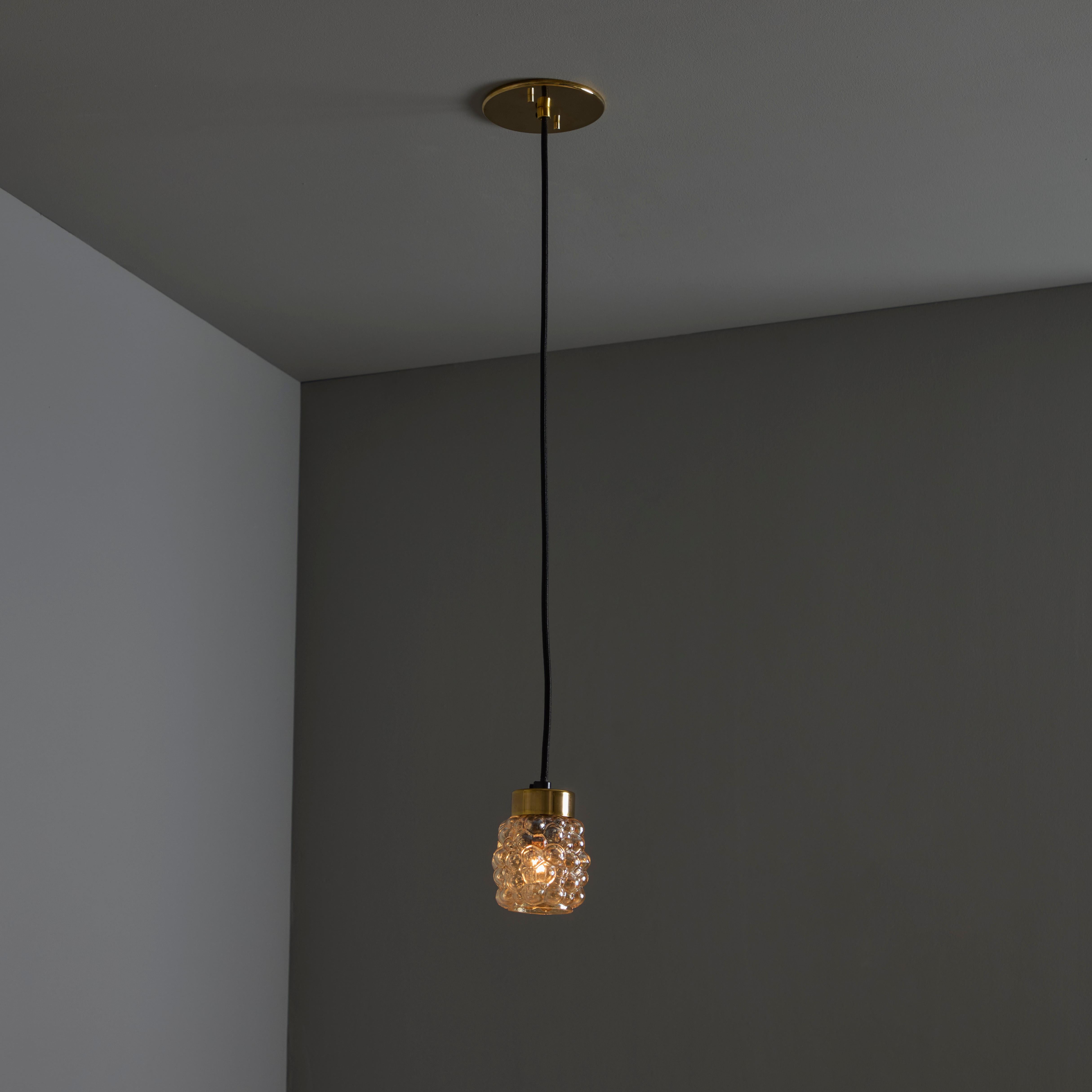 1960s Helena Tynell Amber Bubble Glass Pendant Lamp for Limburg. Executed in thick and heavy textured amber bubble glass with brass hardware and ceiling plate. Fabricated in Limburg, Germany circa 1960s. Unmarked.

A contemporary of Paavo Tynell,