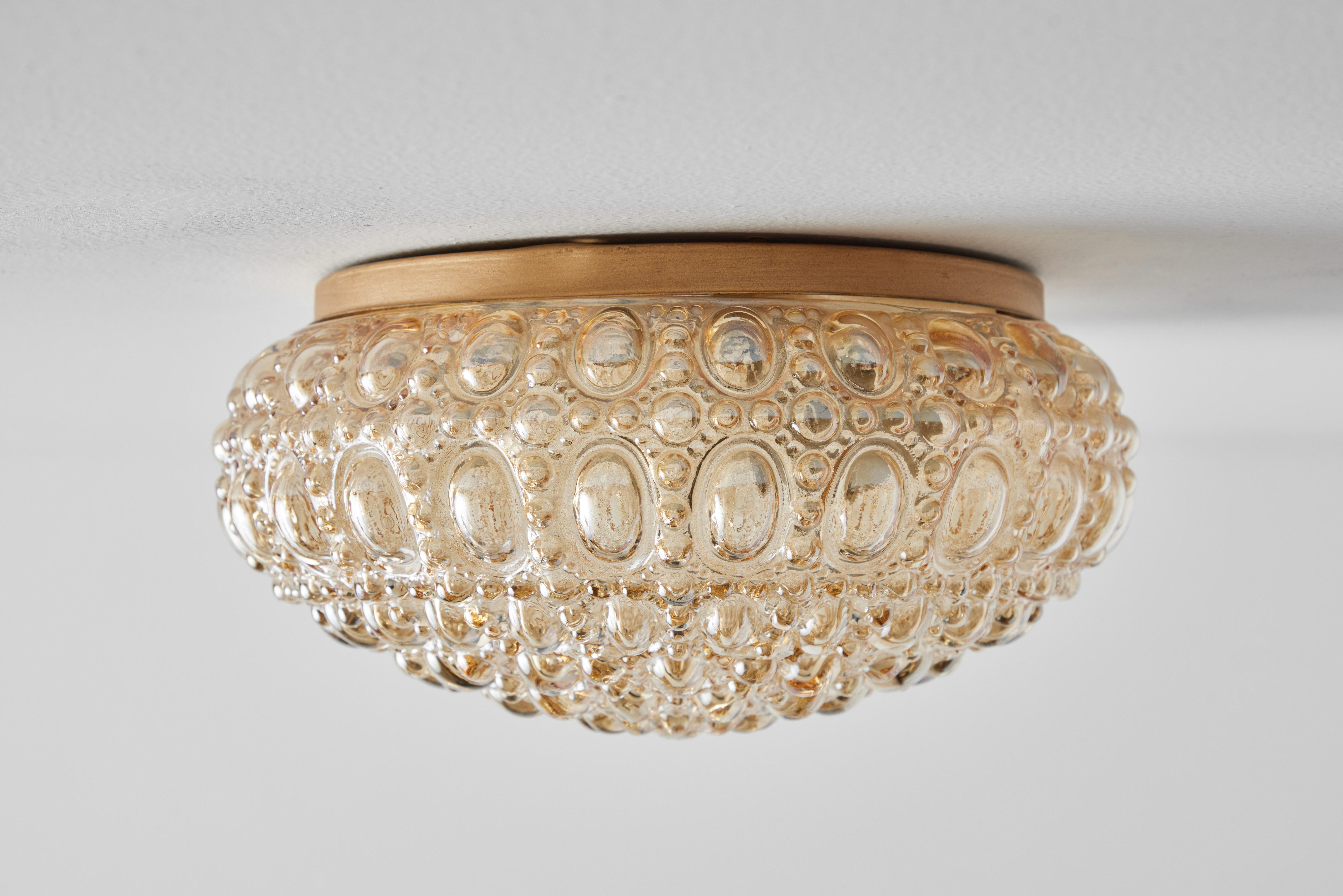 1960s Helena Tynell Model #A665 Amber Bubble Glass Flush Mount for Limburg. Executed in thick and heavy textured amber bubble glass and metal brass mount. Can be mounted on the ceiling or used as a wall lamp. Fabricated in Limburg, Germany circa