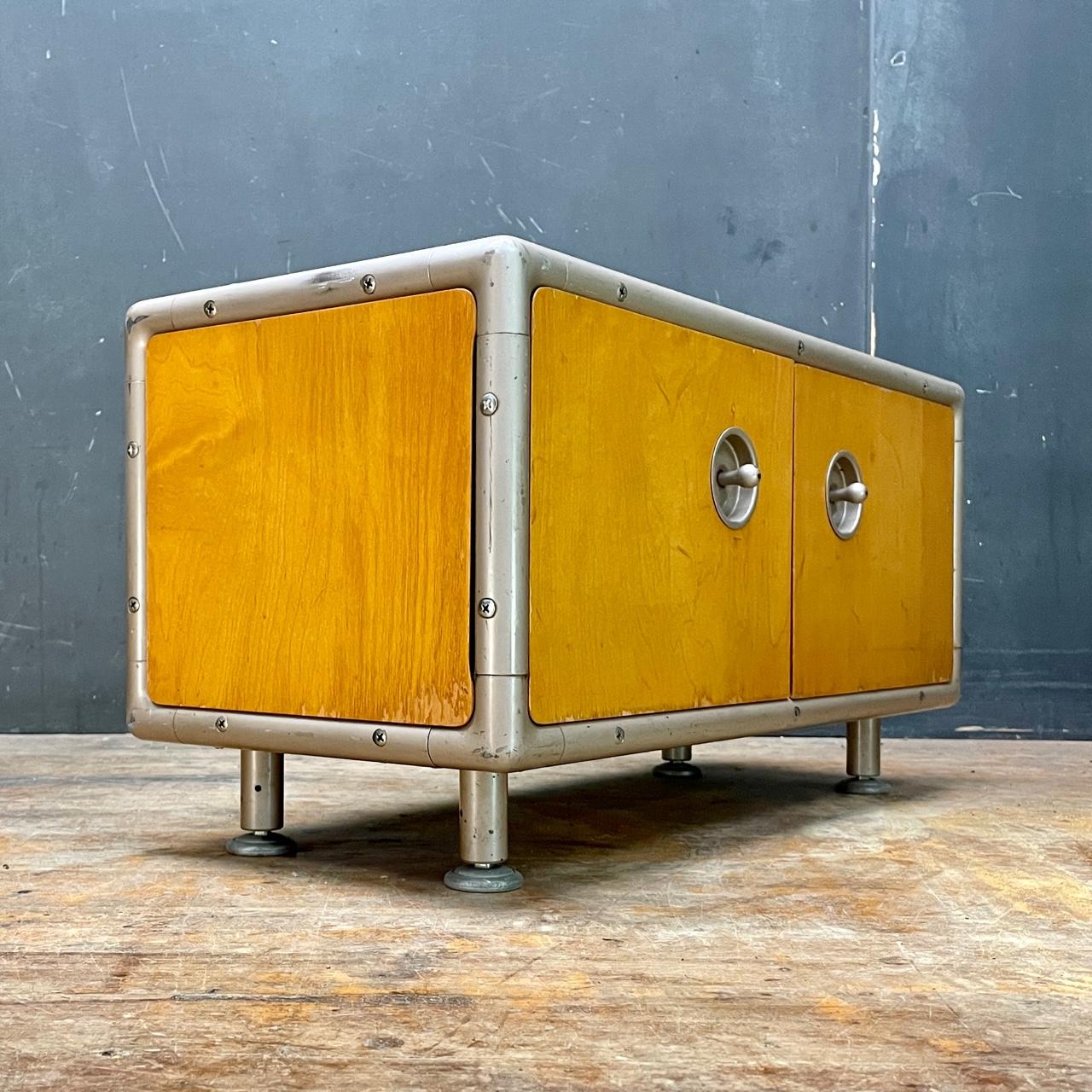 Rare form, a small tabletop cabinet. Doors work well, smooth. Interior shelf with adjustable height. Some wear to finish.