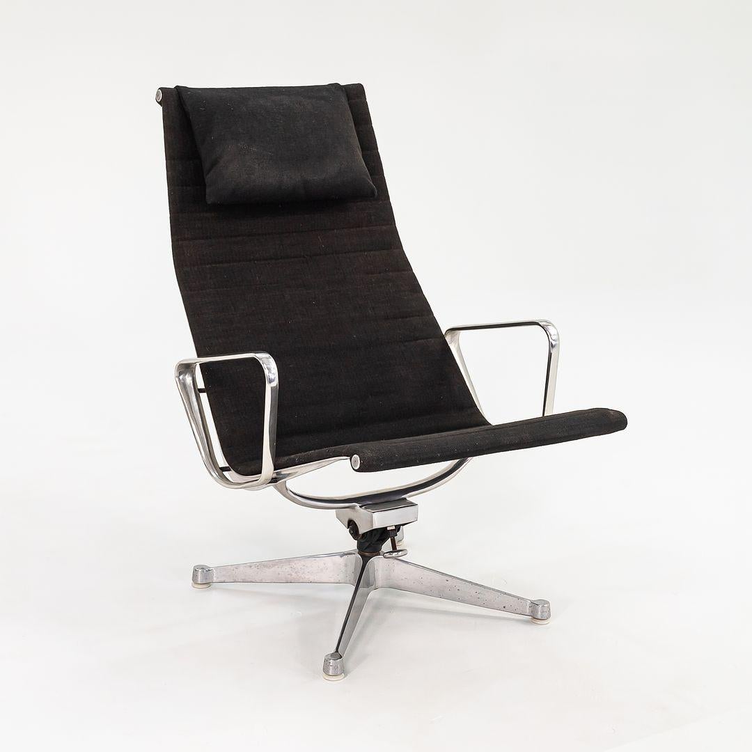 This is an original Eames Aluminum Group Lounge Chair and coordinating Ottoman, Models EA124/EA125, originally designed by Charles and Ray Eames for Herman Miller in 1958. This particular set was produced in the 1960s. The pieces sport solid yet